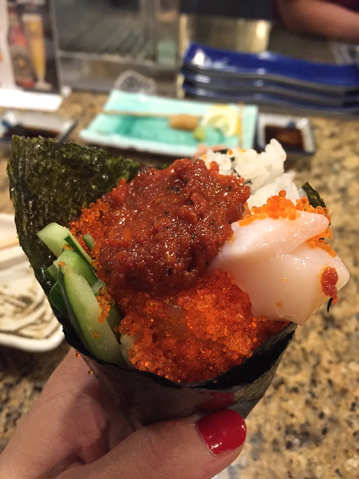 Custom hand roll: Raw scallop with homemade Korean gogchujang sauce. Never knew this would work, now I'm a believer...