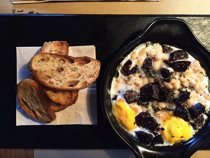 Catalan blood sausage with baked eggs, beans-Taranna restaurant, Barcelona