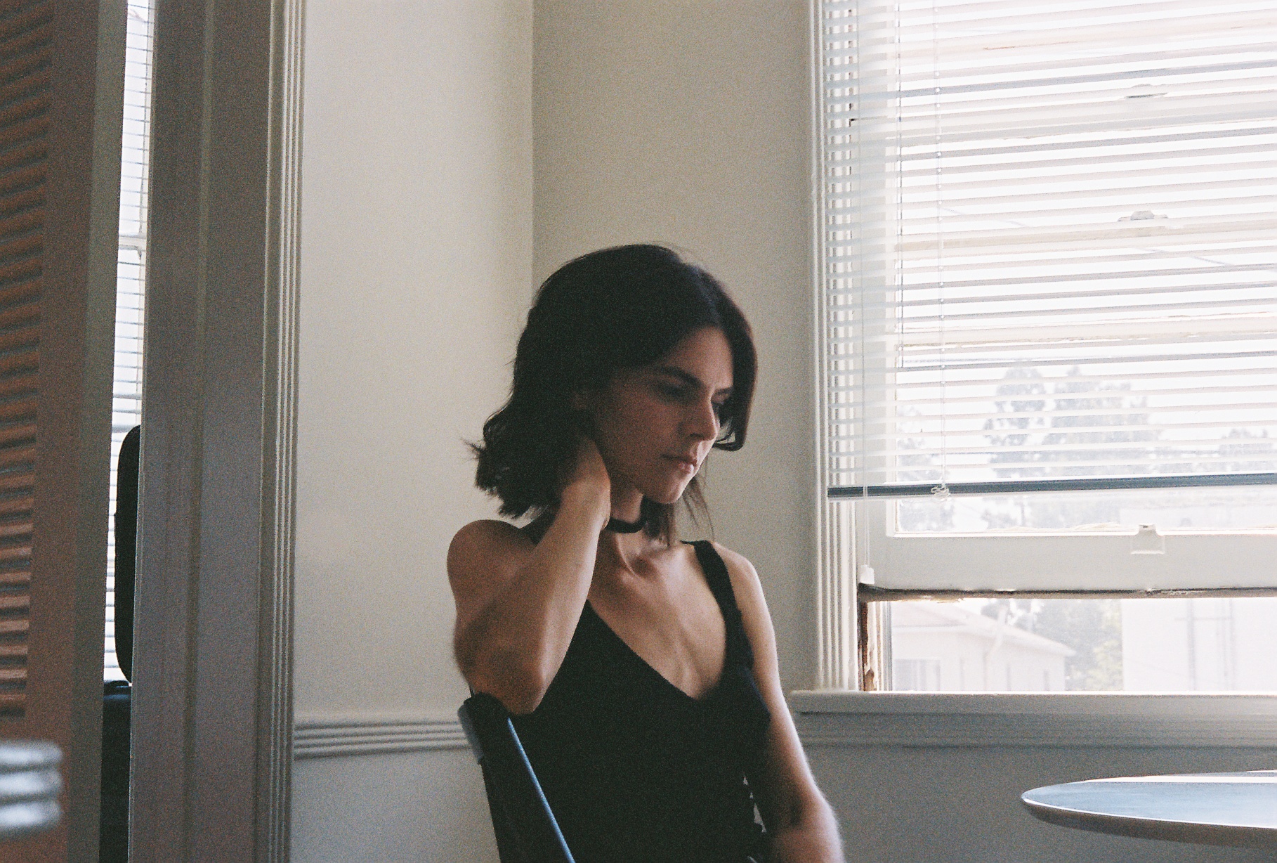 On the same roll, a Robin Plotnik sits in her kitchen from the summer before last. 