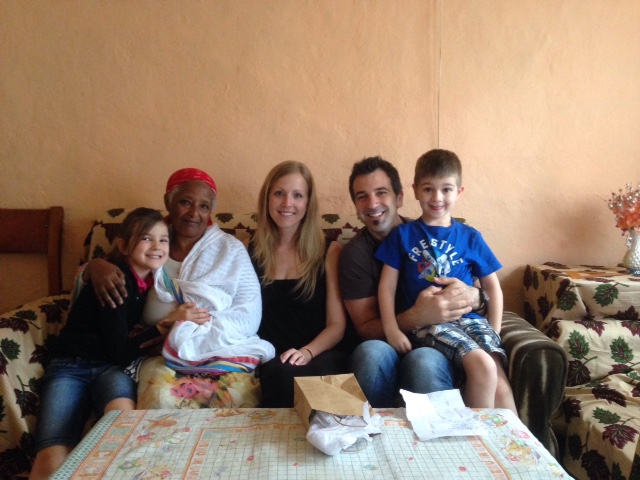Yaphet's nonna with her arm around Elianna, Gabriel is on Mark's lap and Ruthi is in the middle of it all.