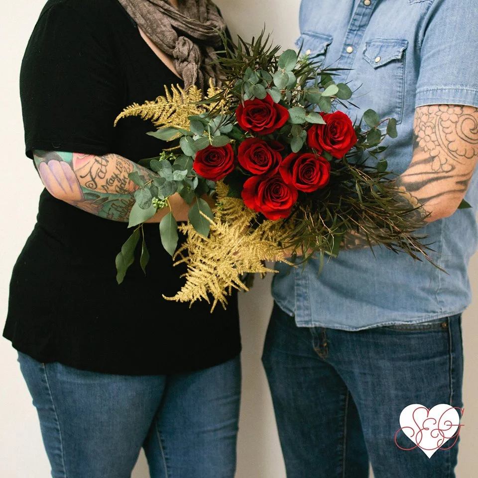 CB&CB’s love is terrifically bold, sultry, & fierce -- Featuring premium red long stem roses, gilded plumosa fern, agonis and eucalyptus.