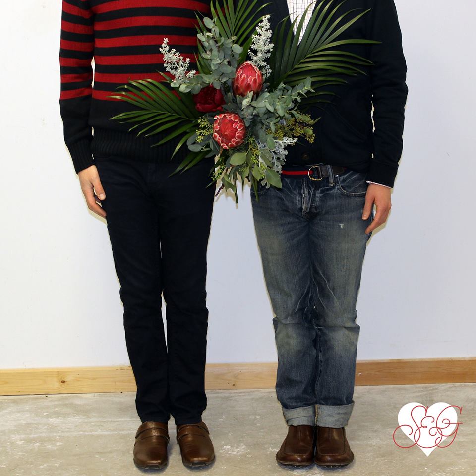 B&D’s love is ultra stylish, dashing, & sexy -- Featuring protea, kochia & peonies mixed with tropical foliage & seeded eucalyptus. 