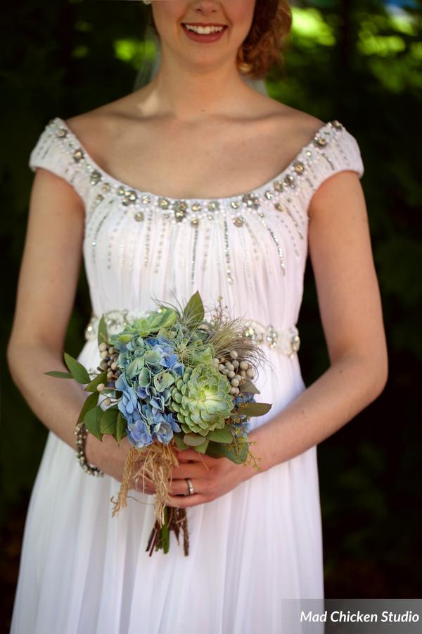 Alexis's bouquet consisted of echeveria, air plants, Dutch hydrangea, silver brunia, & eucalyptus.