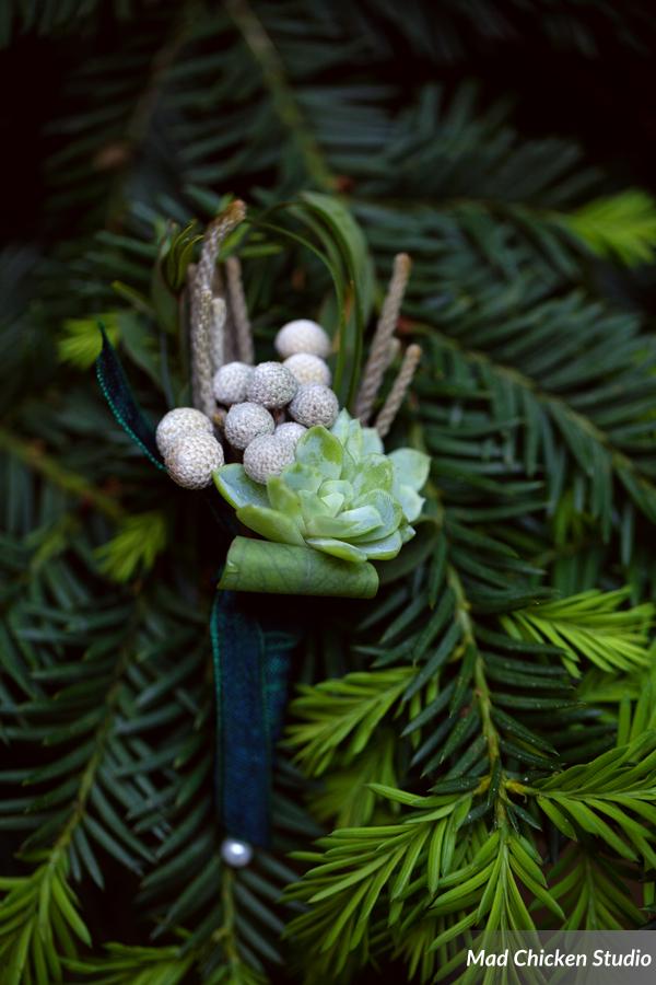 Eric's boutonniere featured e cheveria, bear grass, and silver brunia. The teal ribbon wrap really made it pop!