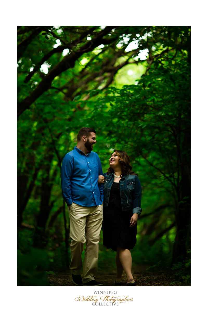 2 Walking through the forest engaged engagement shoot winnipeg Tony.jpg