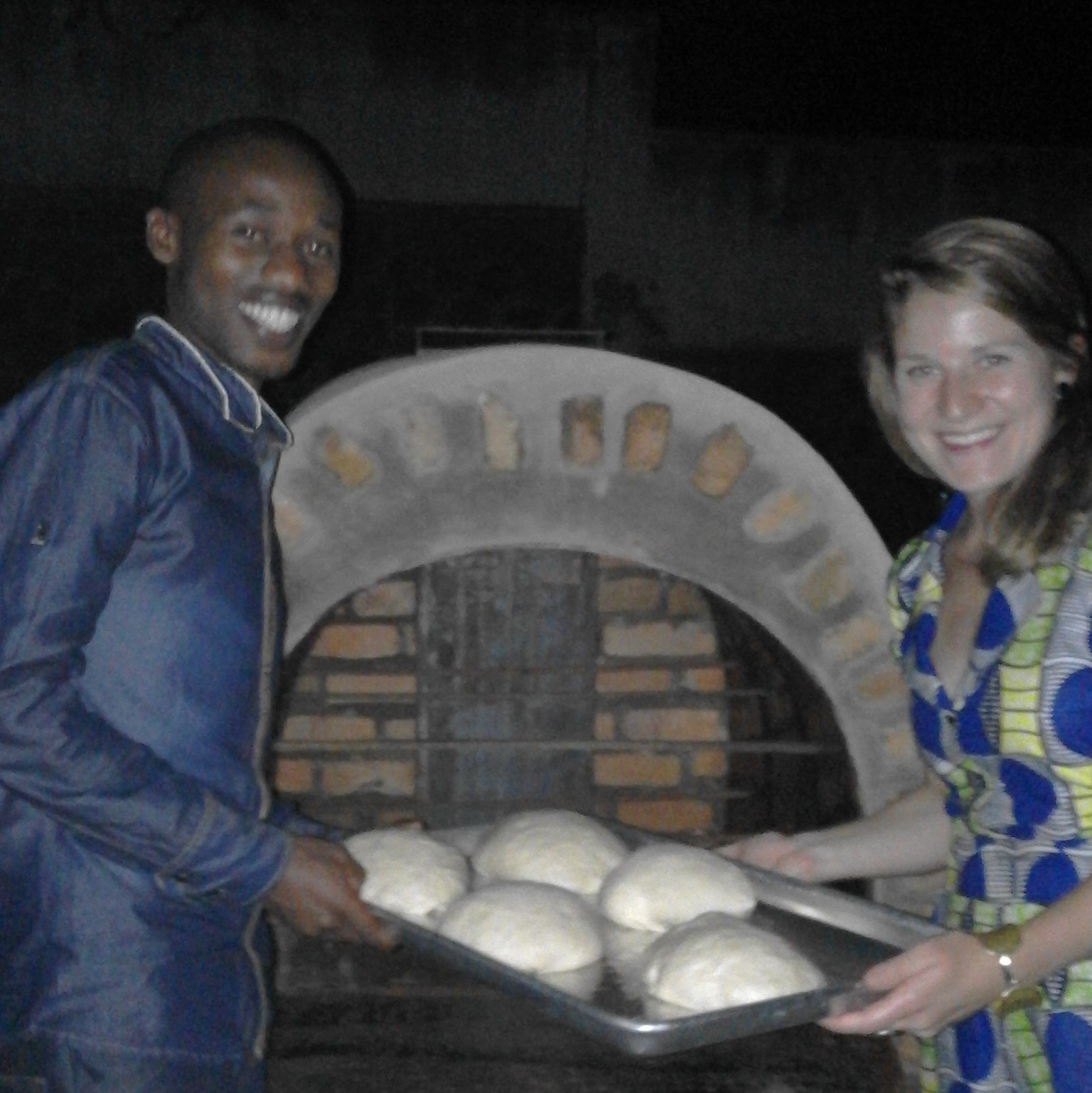 JP, one of the MASS architects for the project, and Meg, East Africa Programs Officer place some TWB loaves in the oven for baking tests! TWB is thrilled at the prospect of a prototype design for the organization and the future of ovens in our bakeries. 