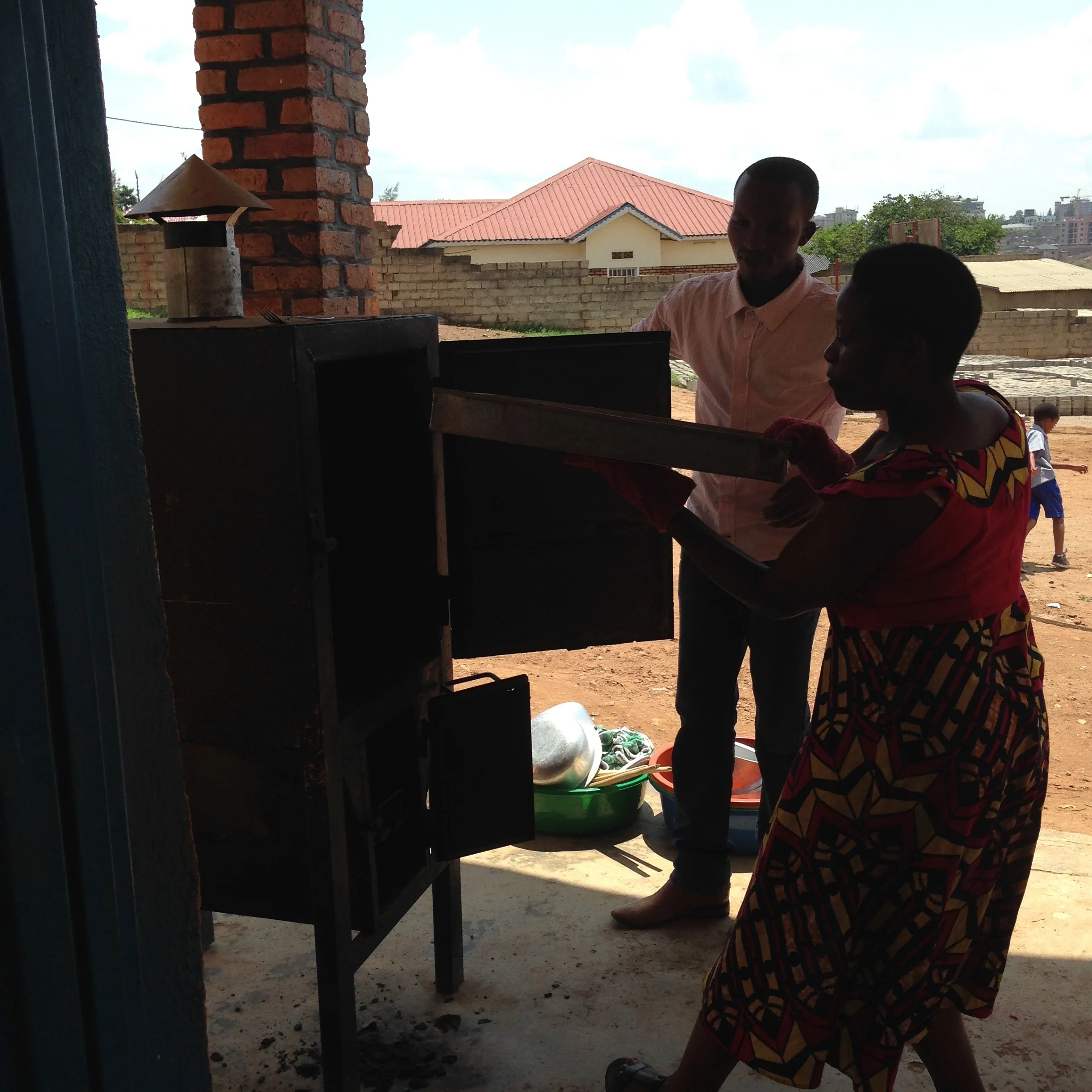 Baking with our old oven during training, 2015. 