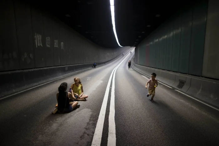 Pro-democracy protestors block traffic from this tunnel in Hong Kong. Photo courtesy of Tyrone Siu/Reuters.