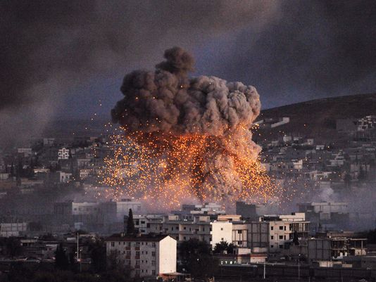 Smoke from an explosion in Kobani, Syria. In response, Turkish authorities are allowing the Peshmerga, Kurdish militia forces, to enter the area and fight against ISIL. Gokhan Sahin, Getty Images