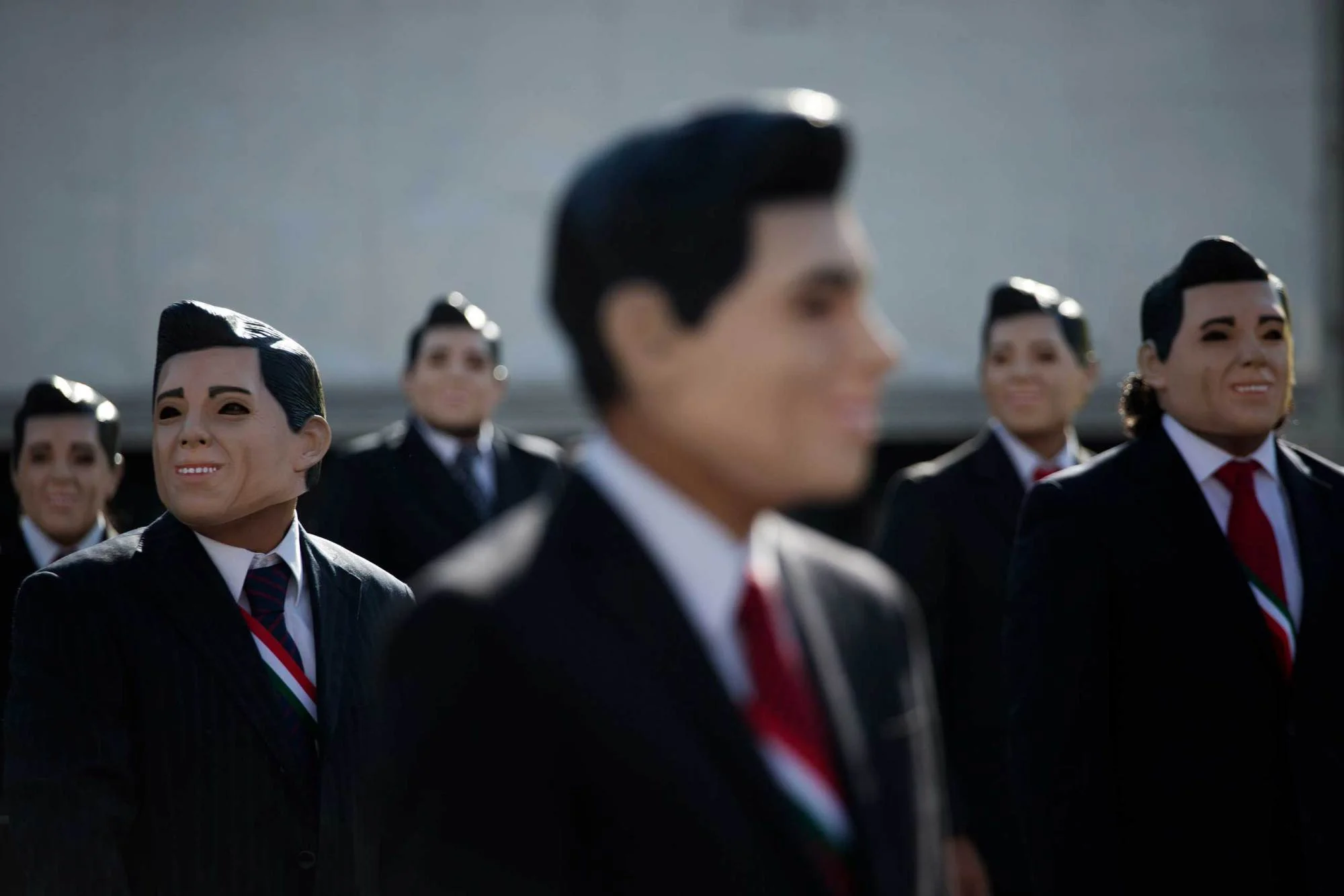 Protestors for Greenpeace, in Mexico City, wearing masks of President Enrique Pena Nieto to question his oil policies. REBECCA BLACKWELL—AP