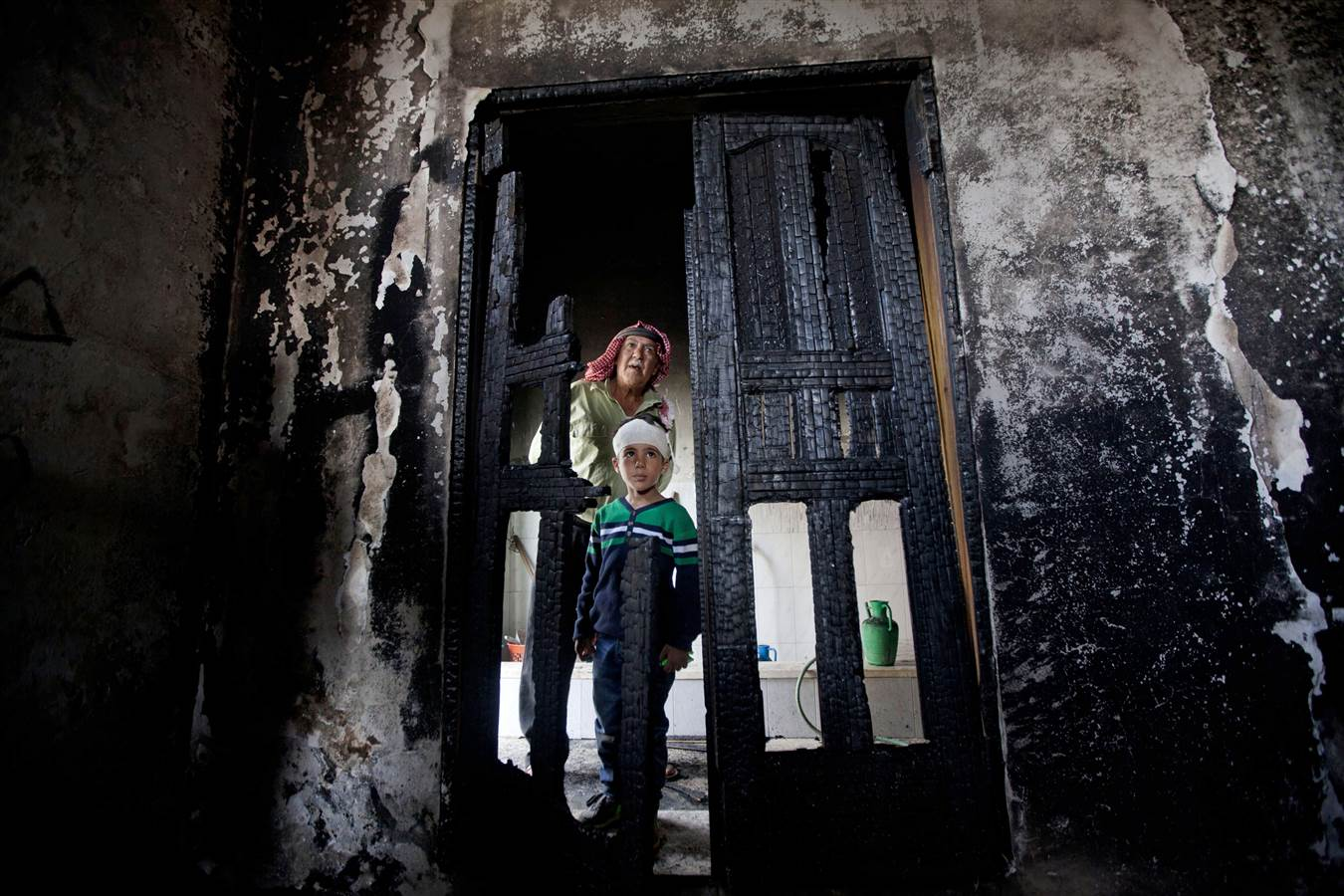 A mosque is burned in the West Bank village of Al Mghreir on Nov 12 amid rising Israel-Palestinian tensions. Source: Majdi Mohammed/AP.