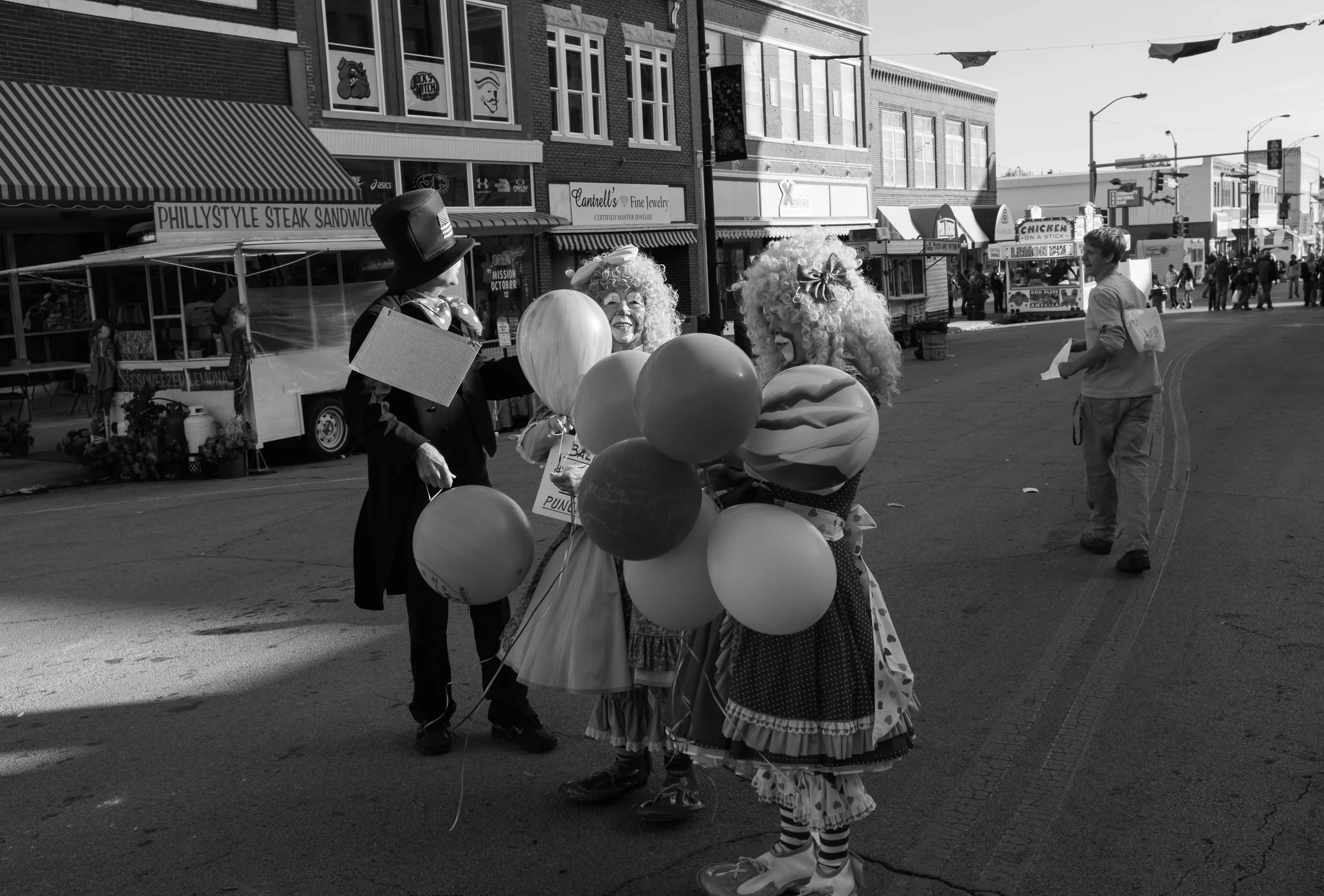 I saw a young kid walking around with a sign that says "Free Hugs". He walked up to three clowns and asked them if they wanted a free hug and they said no thank you. You know its a bad day when 3 clowns won't give you a hug.