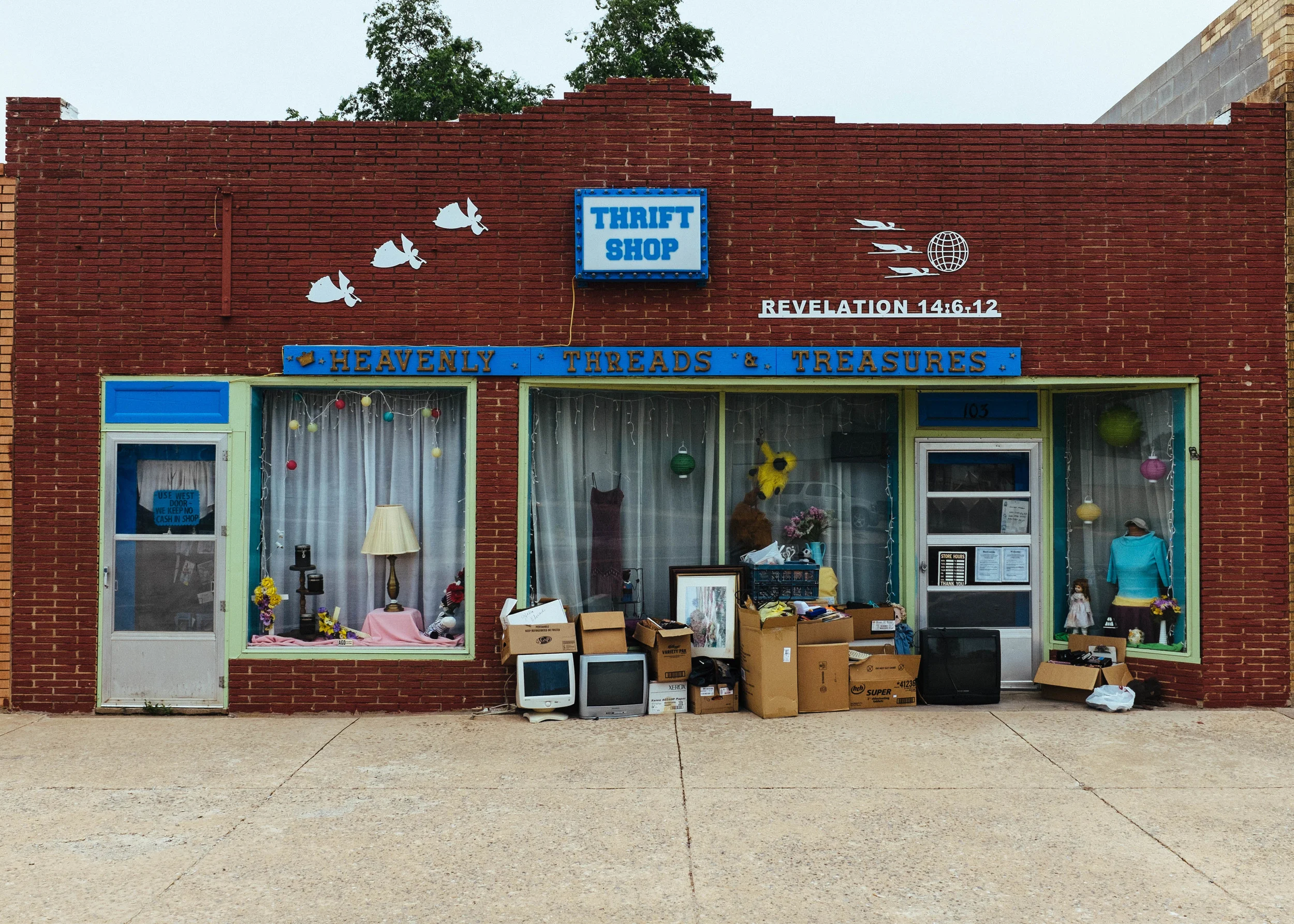 If you notice the thirst shop has a Revelation bible verse on the right side. It has to do with the three angels above it. I suggest looking up the verse. It is a very interesting to have on the side of a thrift shop.