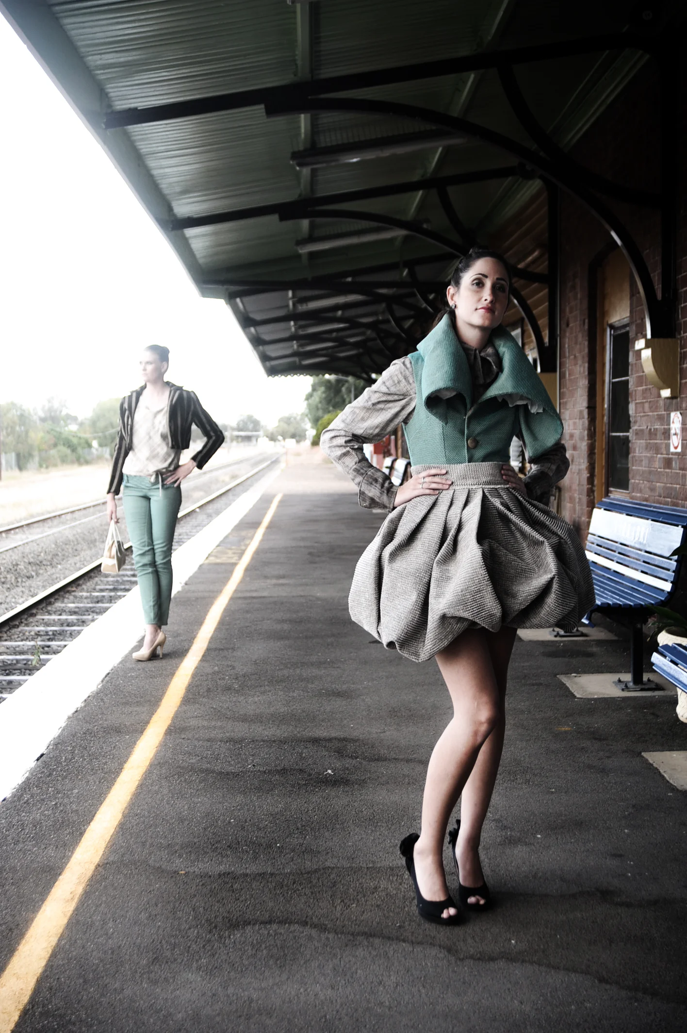 high fashion two girls waiting for train.jpg