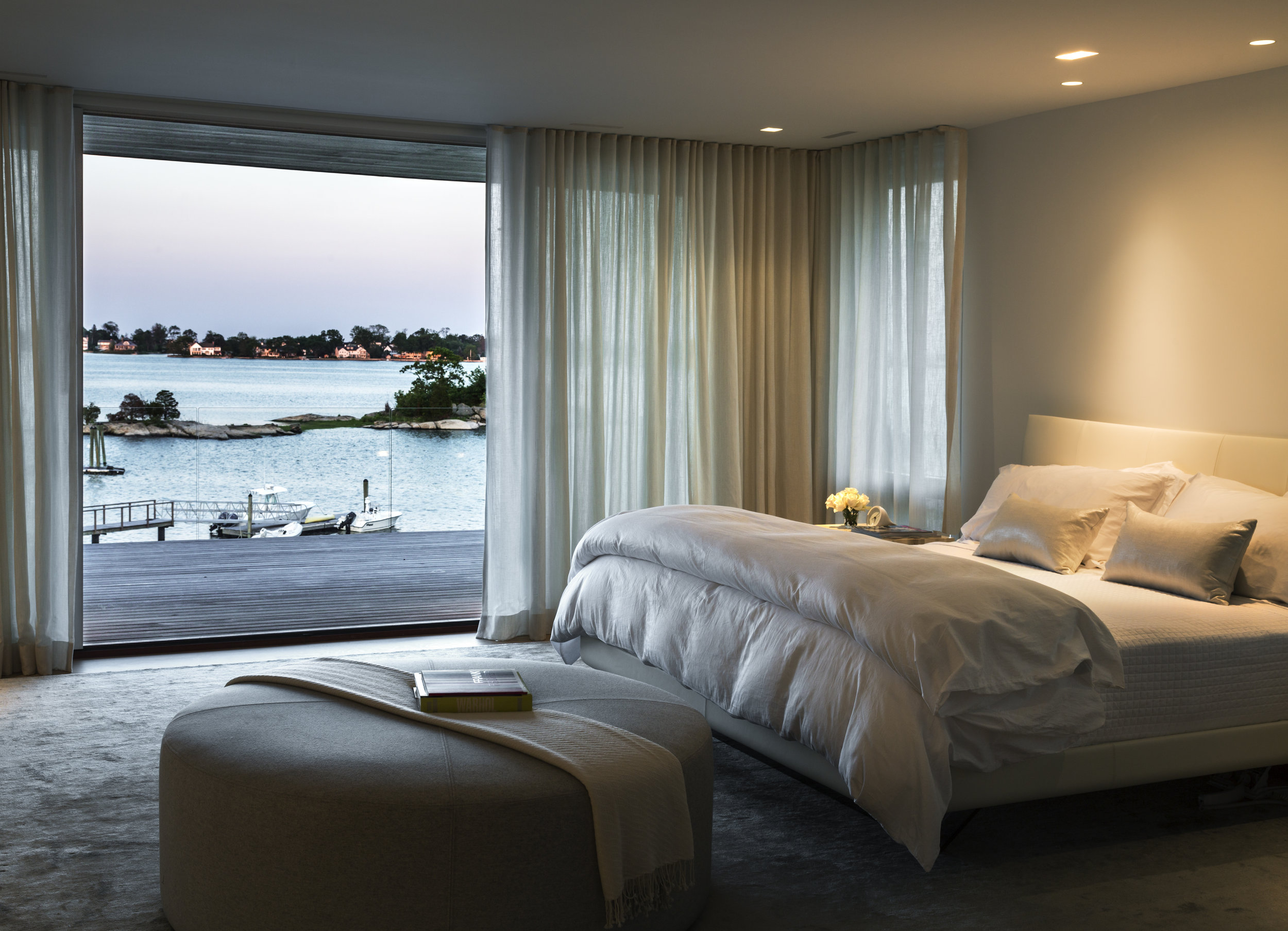 comfortable luxury bedroom waterfront views