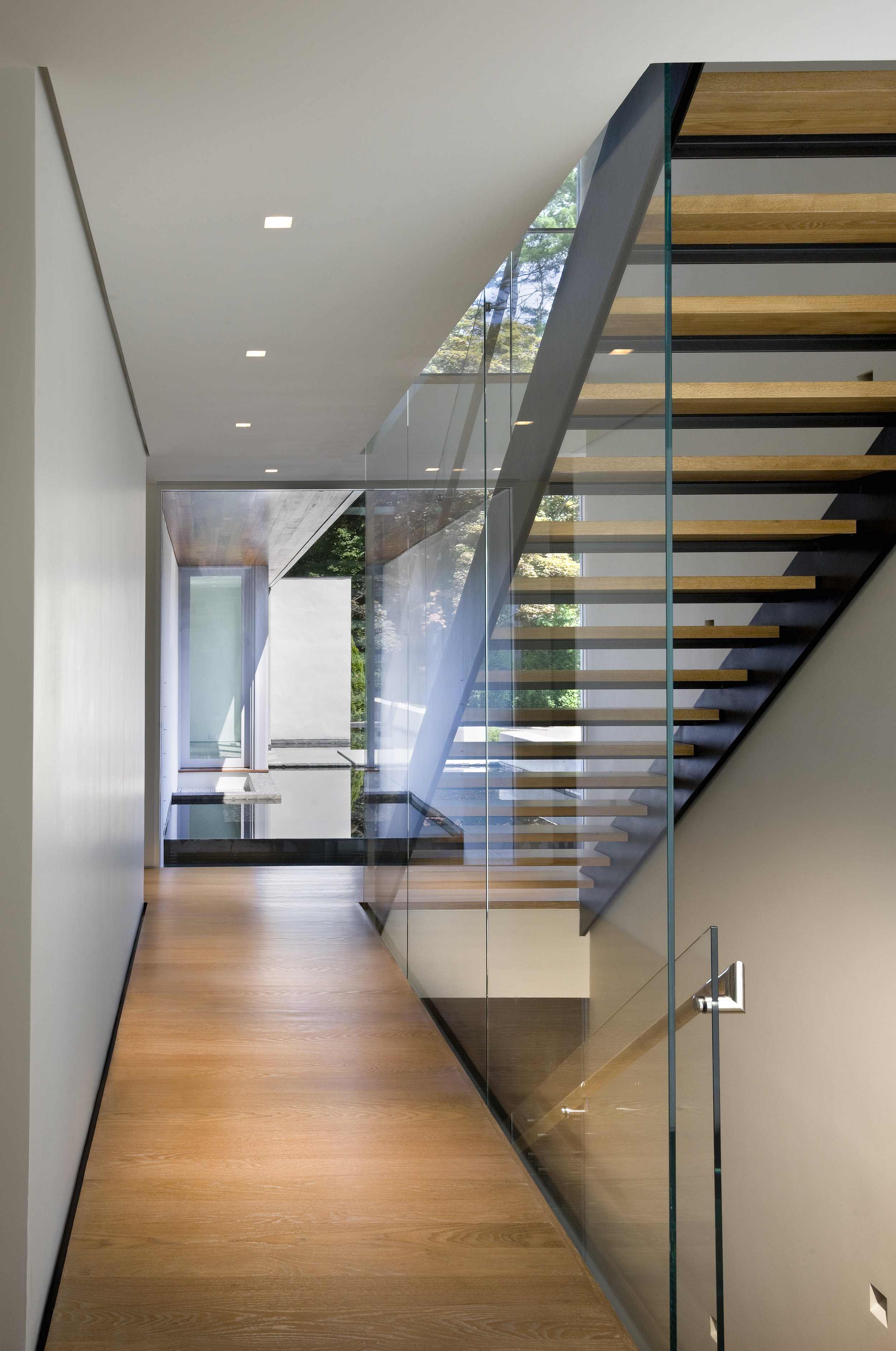 glass walled wooden staircase steel 