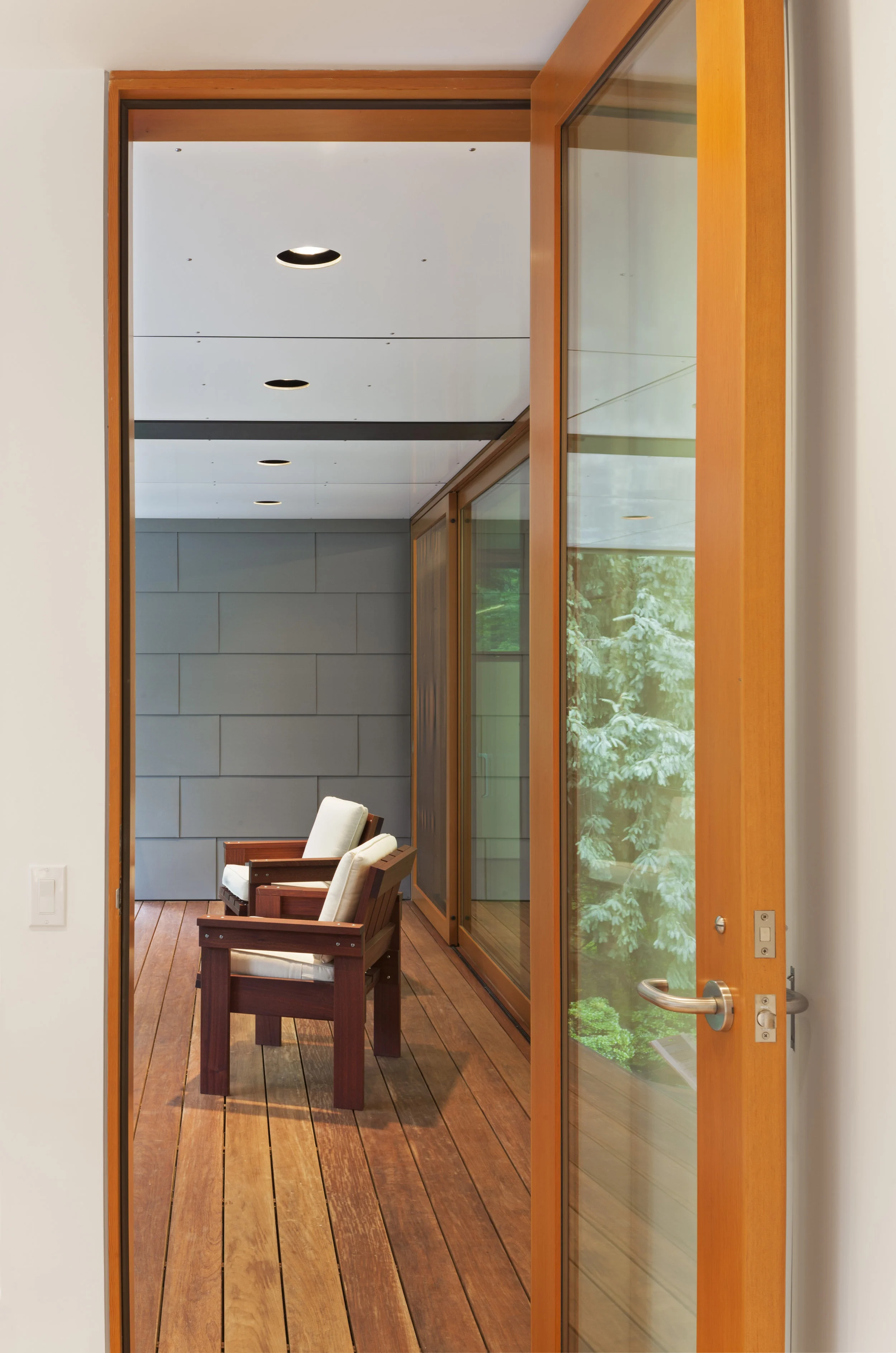 bright glass seating area hallway