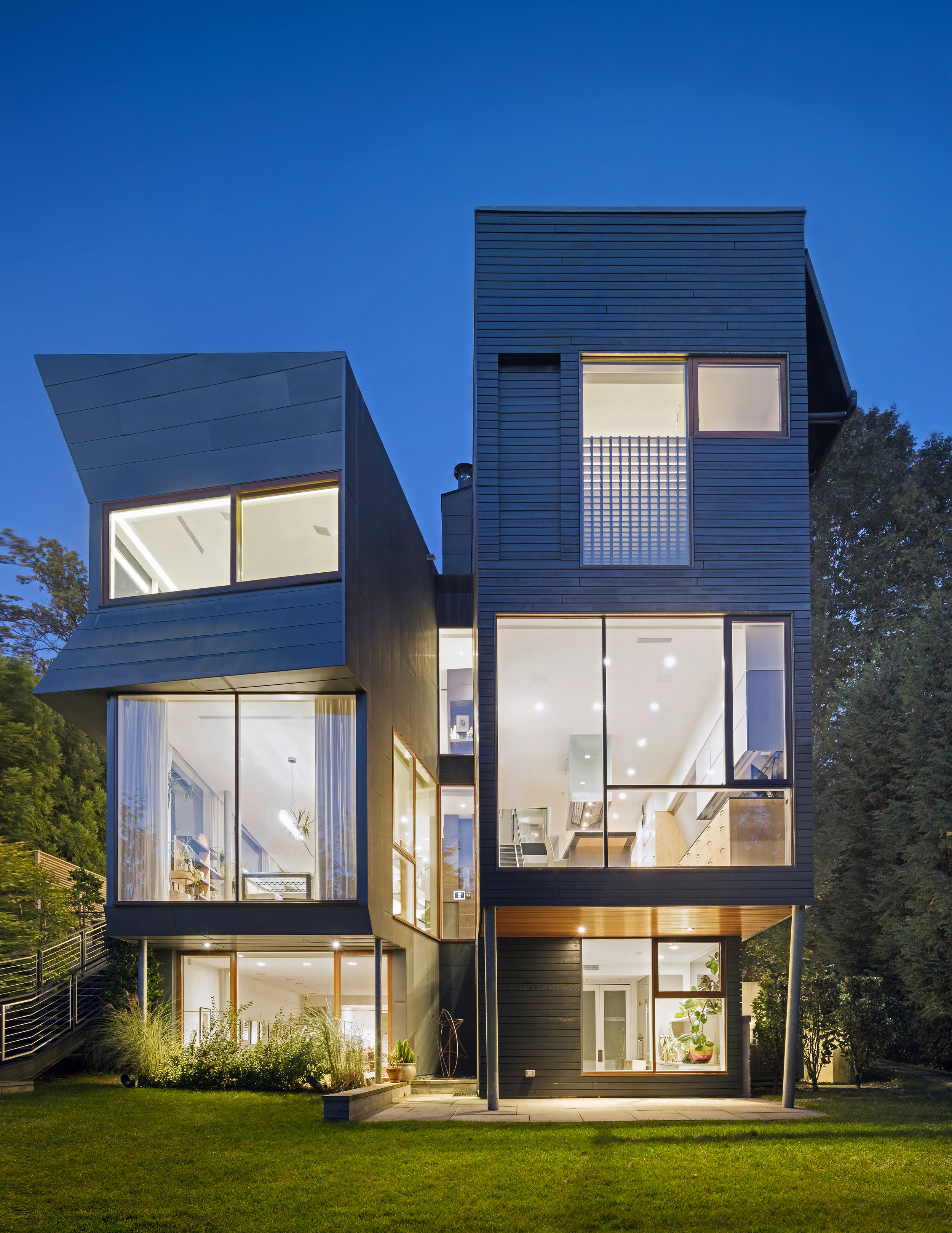 two volume townhouse curtain wall windows with a view