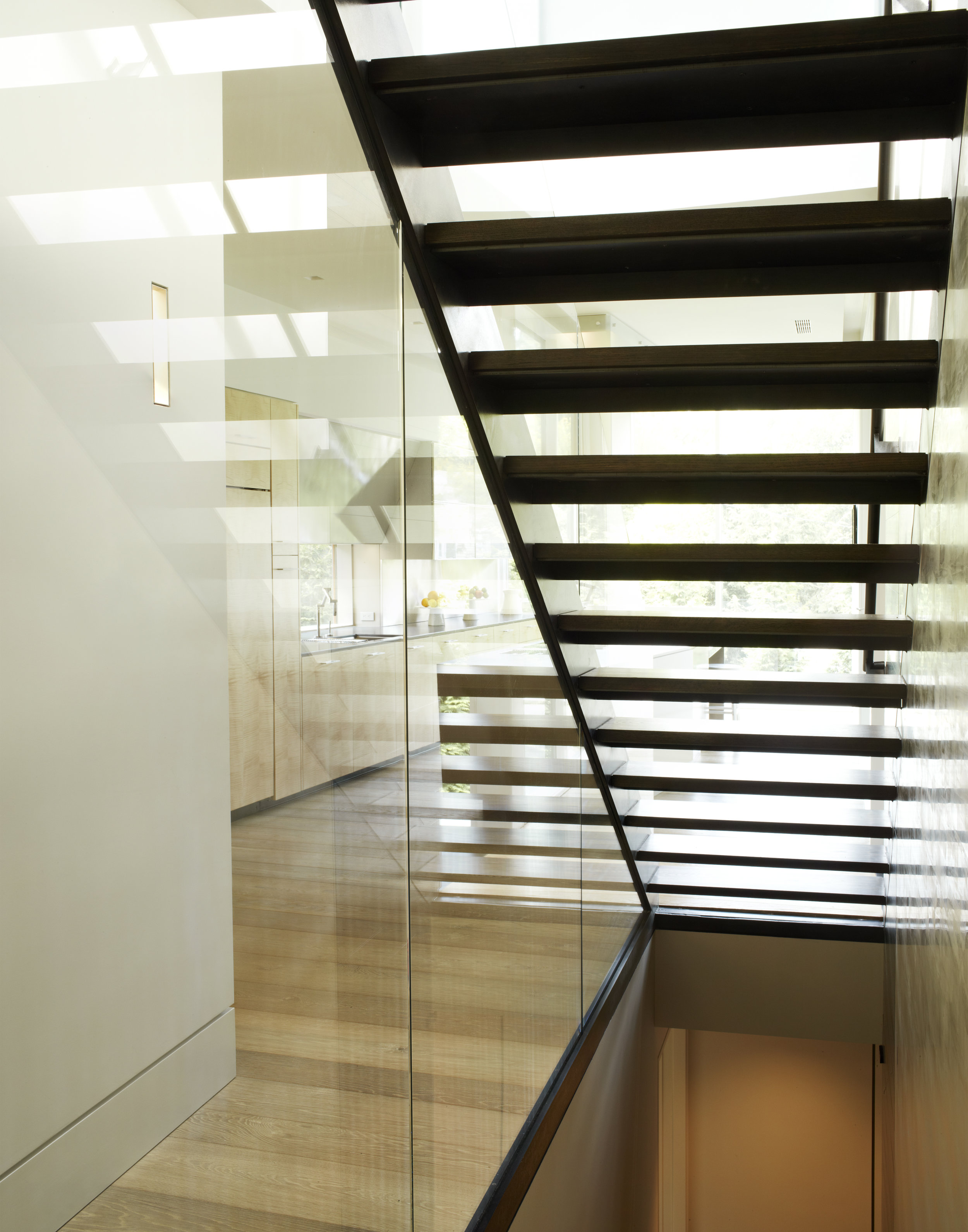 glass staircase wall with lighting