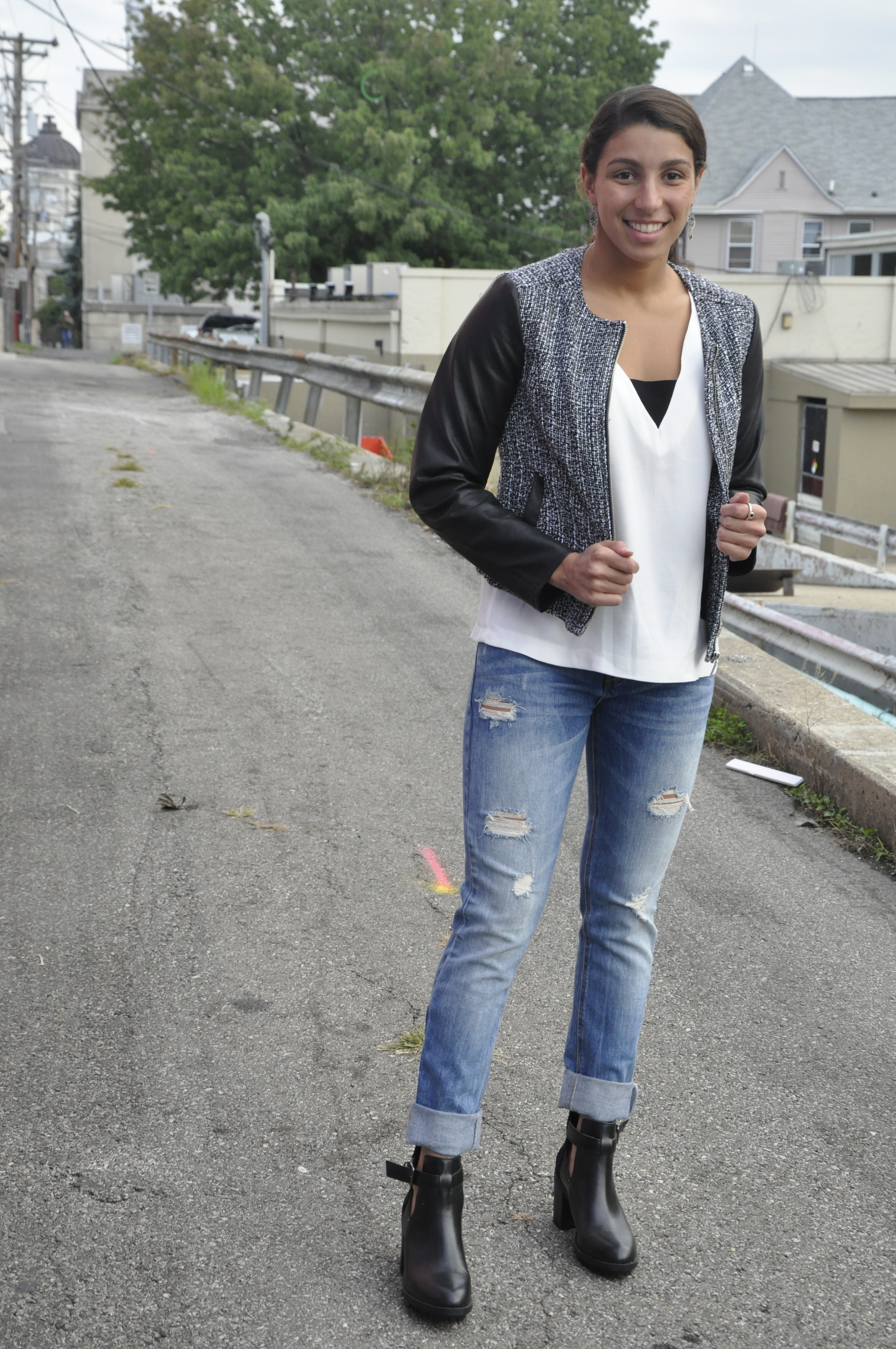 A cute pair of slightly torn jeans are an asset to any ladies' closet! Of course, try to stay away from the overwhelmingly ripped jeans. These Zara bottoms help to make this look more casual while still maintaing the chic factor that we are all going for. The light wash of the jeans takes the severity out of the all black and white top/jacket. 