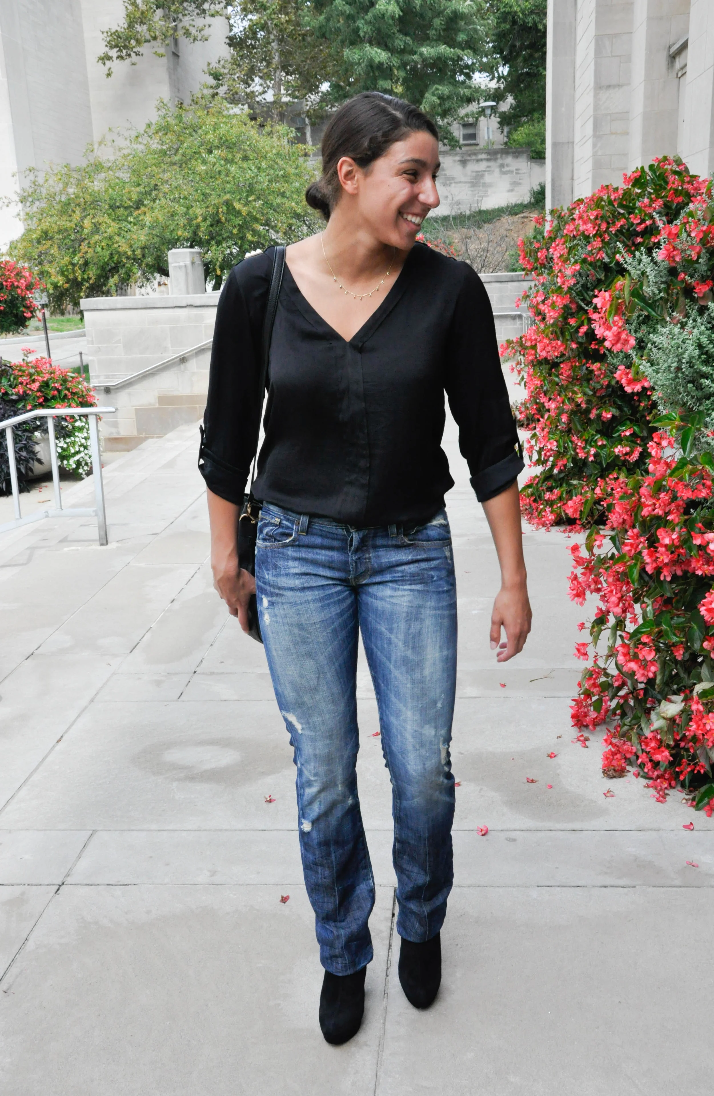 This Zara top is unique because of the shoulder embellishments (a close up can be found further down on the post). The gold perfectly compliments the gold stone necklace as well as the gold details on the bucket bag. The embellishments take a nice and normal black v-neck to one with style that will stand out from the rest of them!