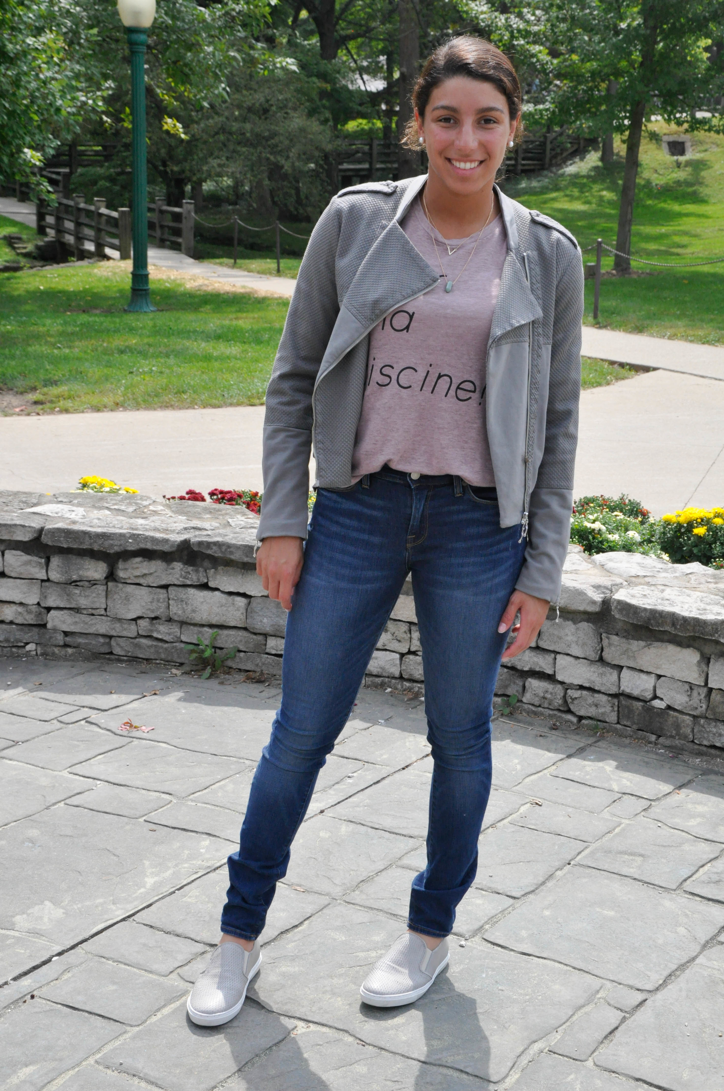 The theme of this look seems to be a European one seeing as both the shoes and the jacket were purchased in The Netherlands, the tank top has French writing on it, and the pants were produced in the good ole U.S.A. What can I say, I guess I’m cultured. Anyhow, I love how although there is a sporty look to this outfit it still remains unique in texture and color. 