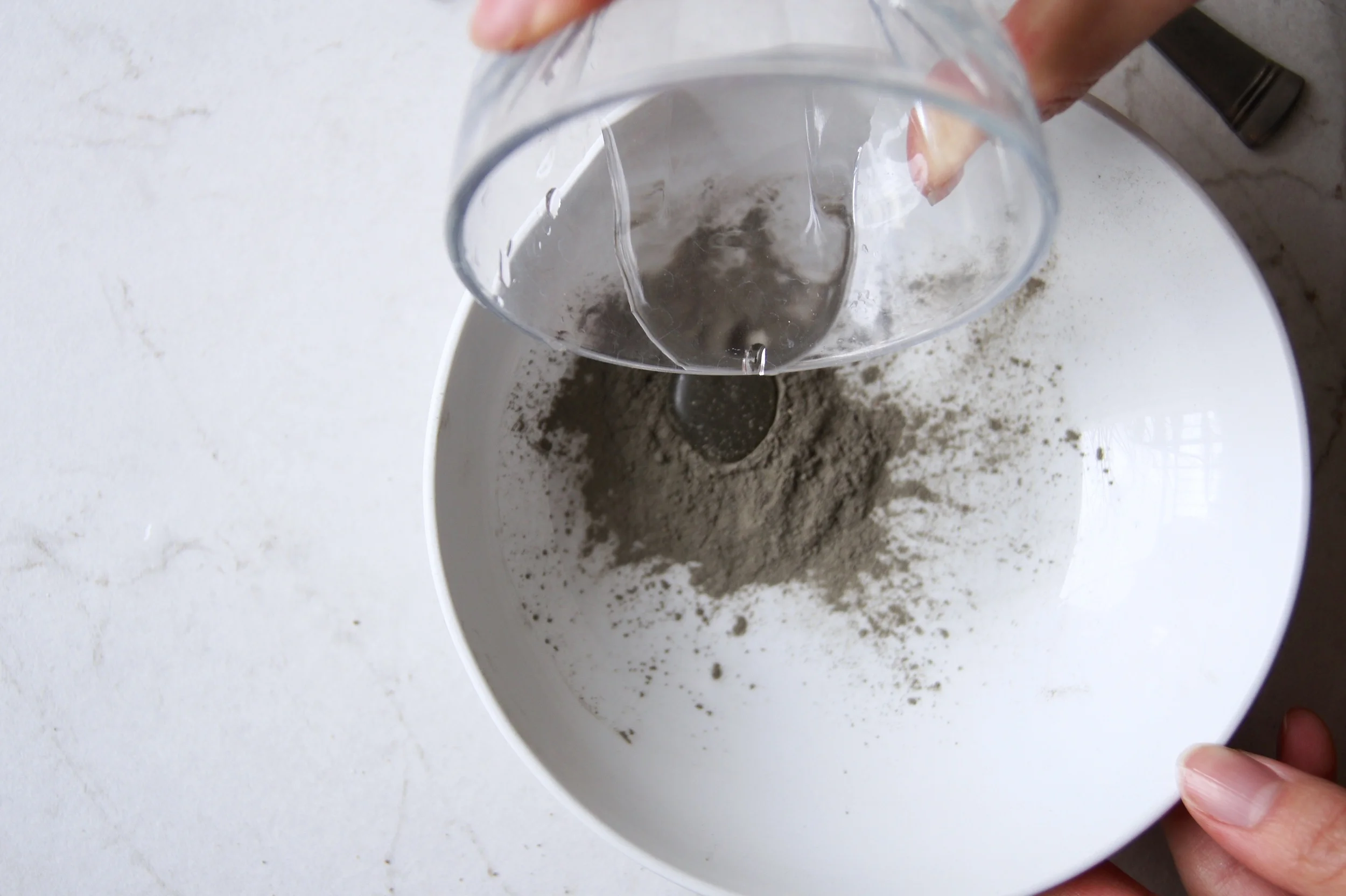Next, pour a few drops of water into the bowl containing your mask to activate the it. You can also use other liquids like rose water, apple cider vinegar or green tea for added benefits!