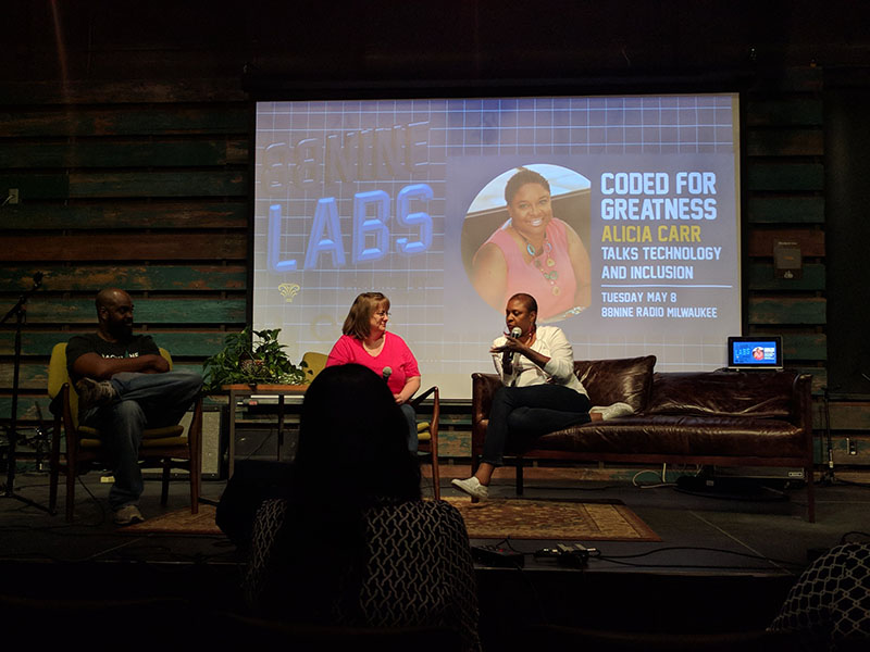 Cynthia Smith, a Senior Engineer from Northwestern Mutual, and Tarik Moody, a DJ from 88.9 Radio Milwaukee, discuss Alicia's work with her. Alicia has jokes, making Cynthia, Tarik, and the audience frequently break out in laughter with her.