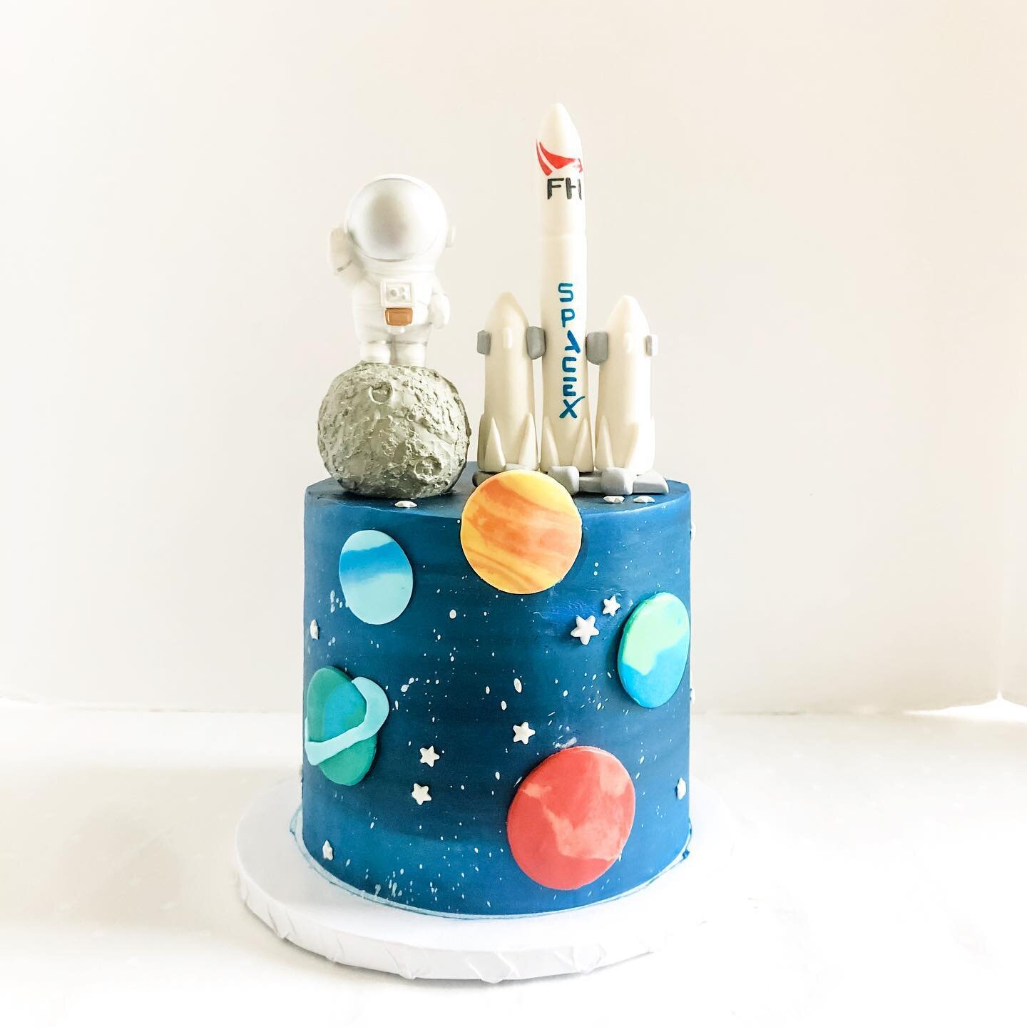 Had a blast making this space themed cake for Ace&rsquo;s 1st birthday. The astronaut on the moon is a toy figurine but the SpaceX rocket was molded out of fondant by our very own cake decorator &amp; fondant artist, Karen! 

I went to high school wi