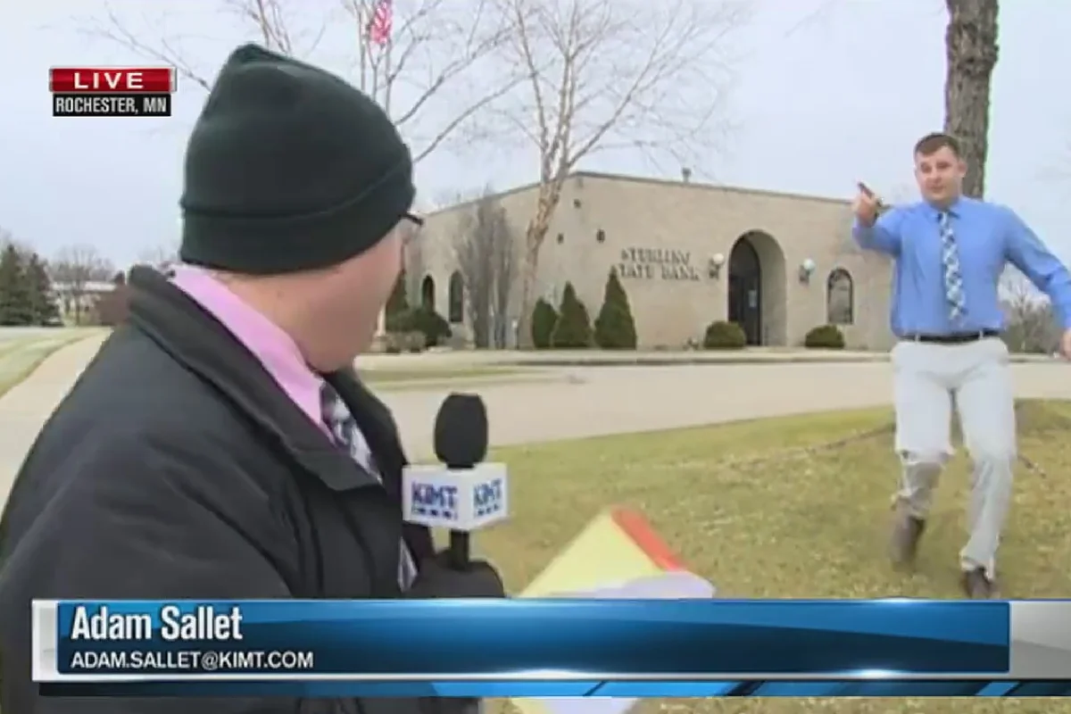 Watch: Rochester bank robbery suspect runs by TV reporter during live shot