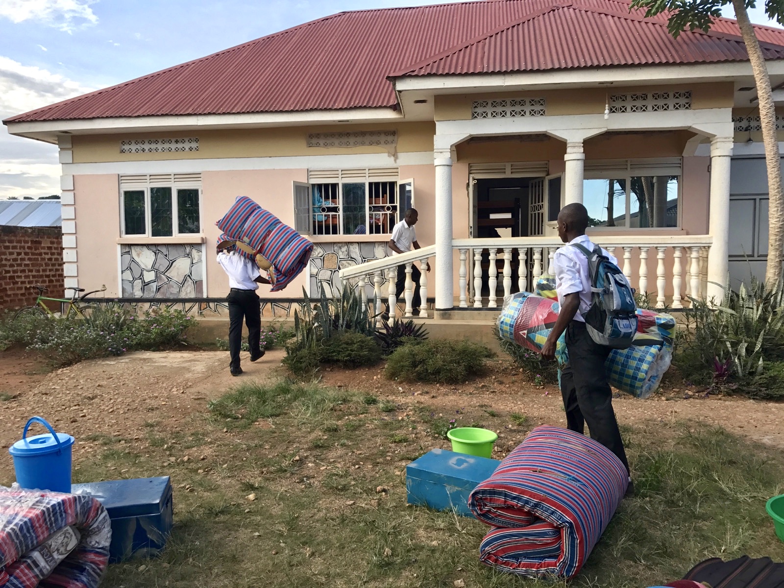 Secondary school boys moving into the boys' dormitory 