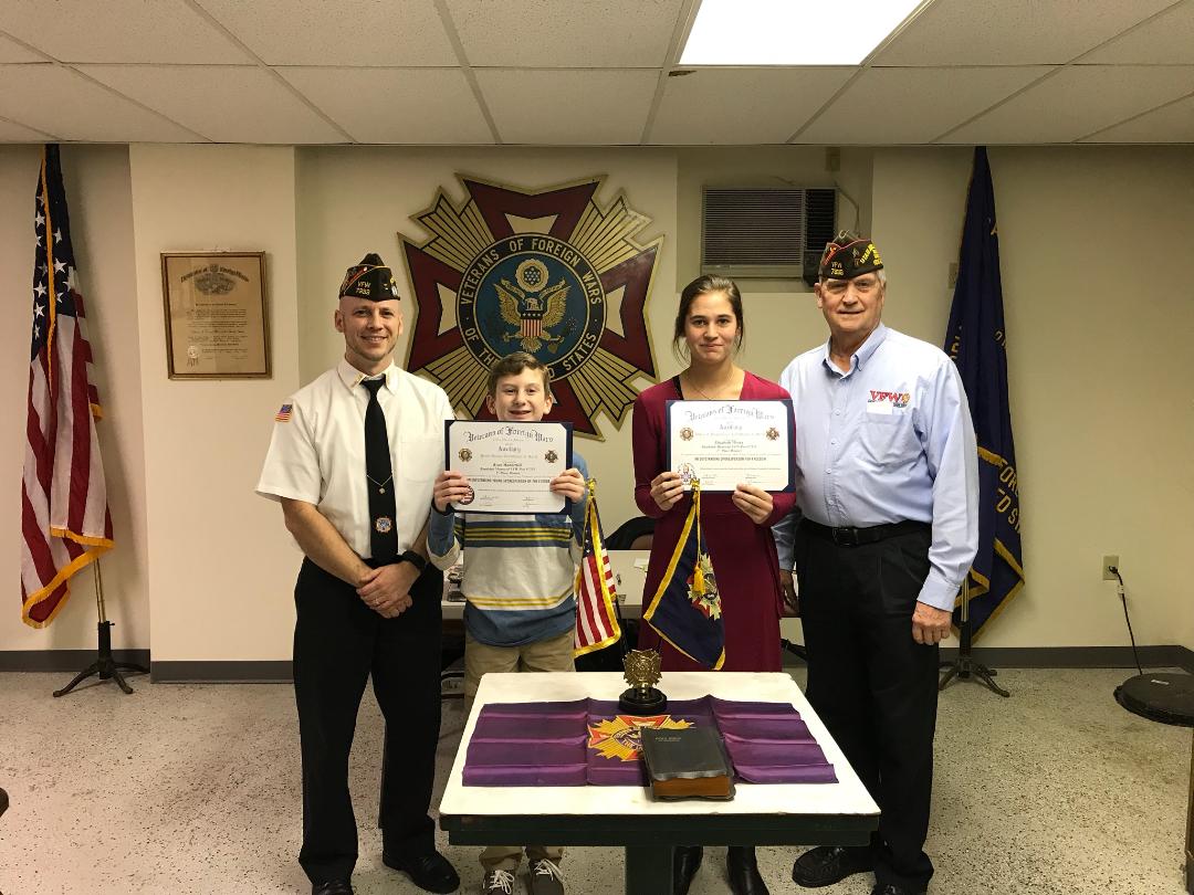 Patriots Pen winner Ryan Manderioli and Voice of Democracy winner Elizabeth Moran with Commander Montanio and Post Programs Chairman Sassaman.