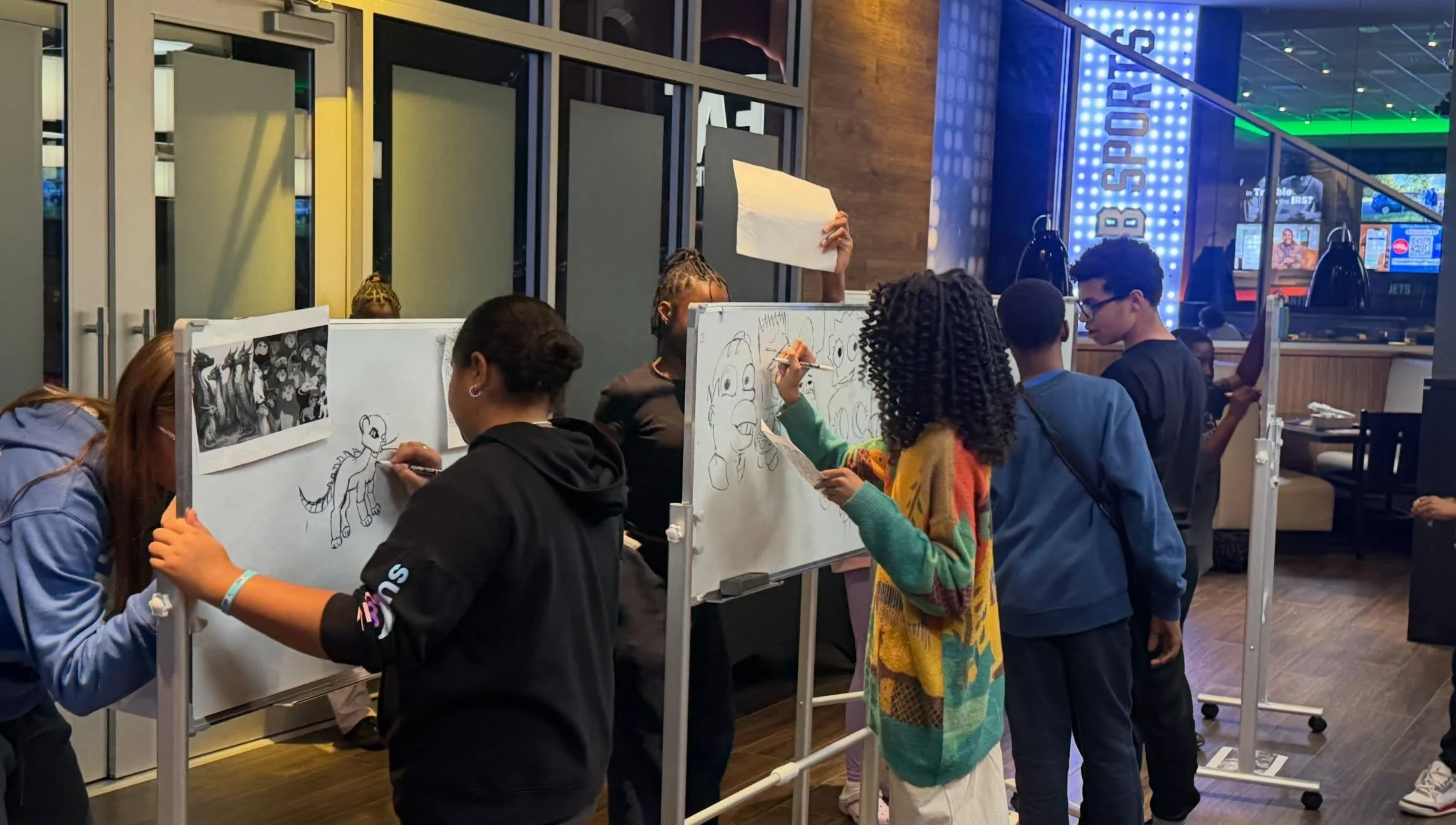 Petrides Students Draw Live at Whiteboard Art Spirit Night