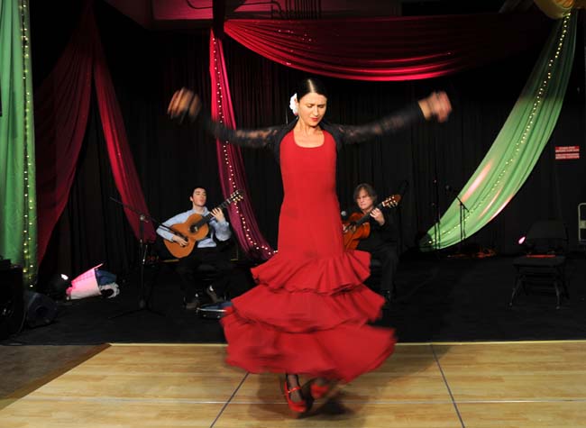Laura Horn does a flamenco dance as Diego Rowan-Martin, left, and Michael Hauser play guitar at the Festival of Nations. Photo Credit: Pioneer Press, Chris Polydoroff