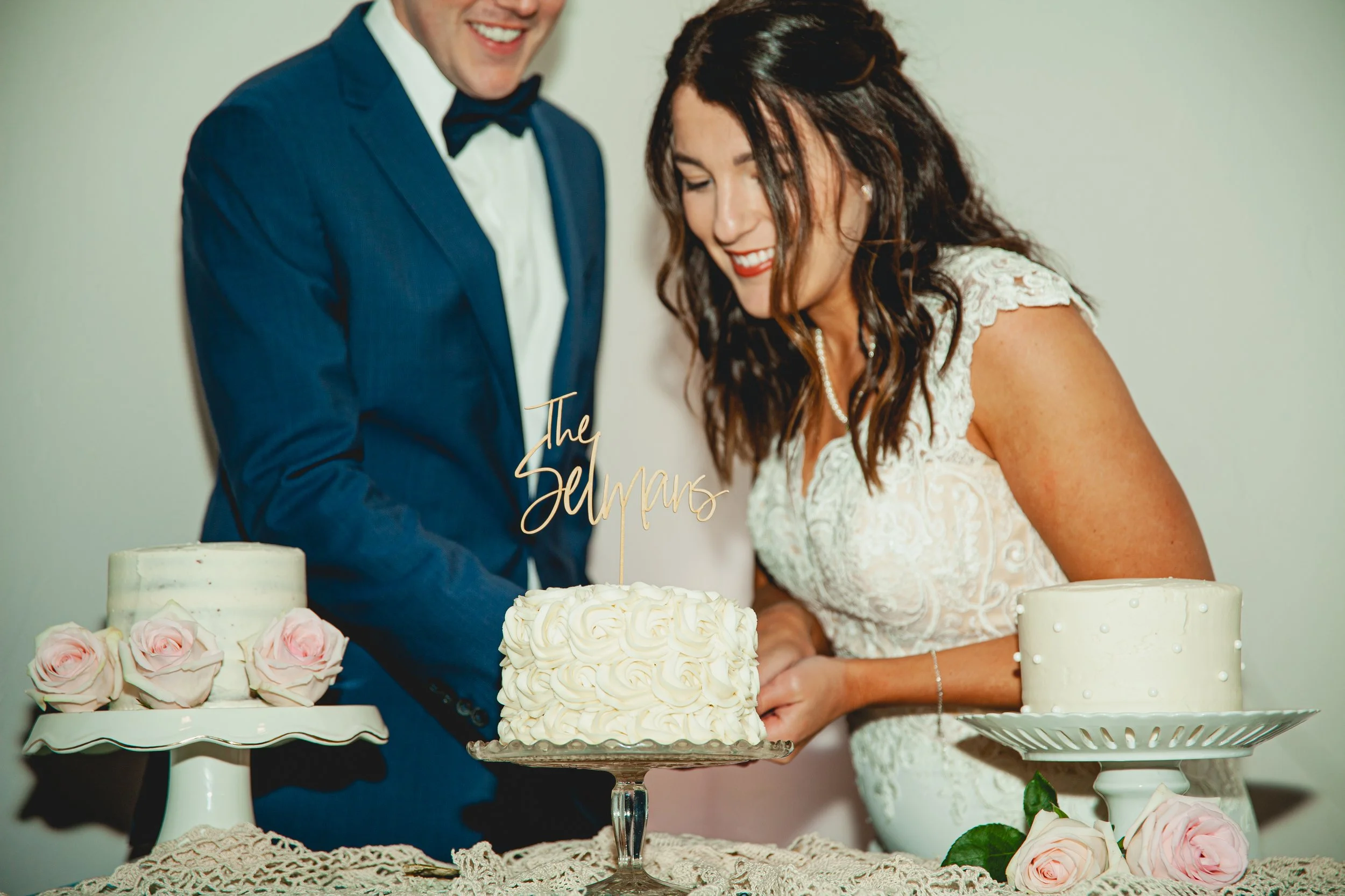  High-Quality Flash Photography: Bride and Groom Cutting Cake at Wedding Reception 
