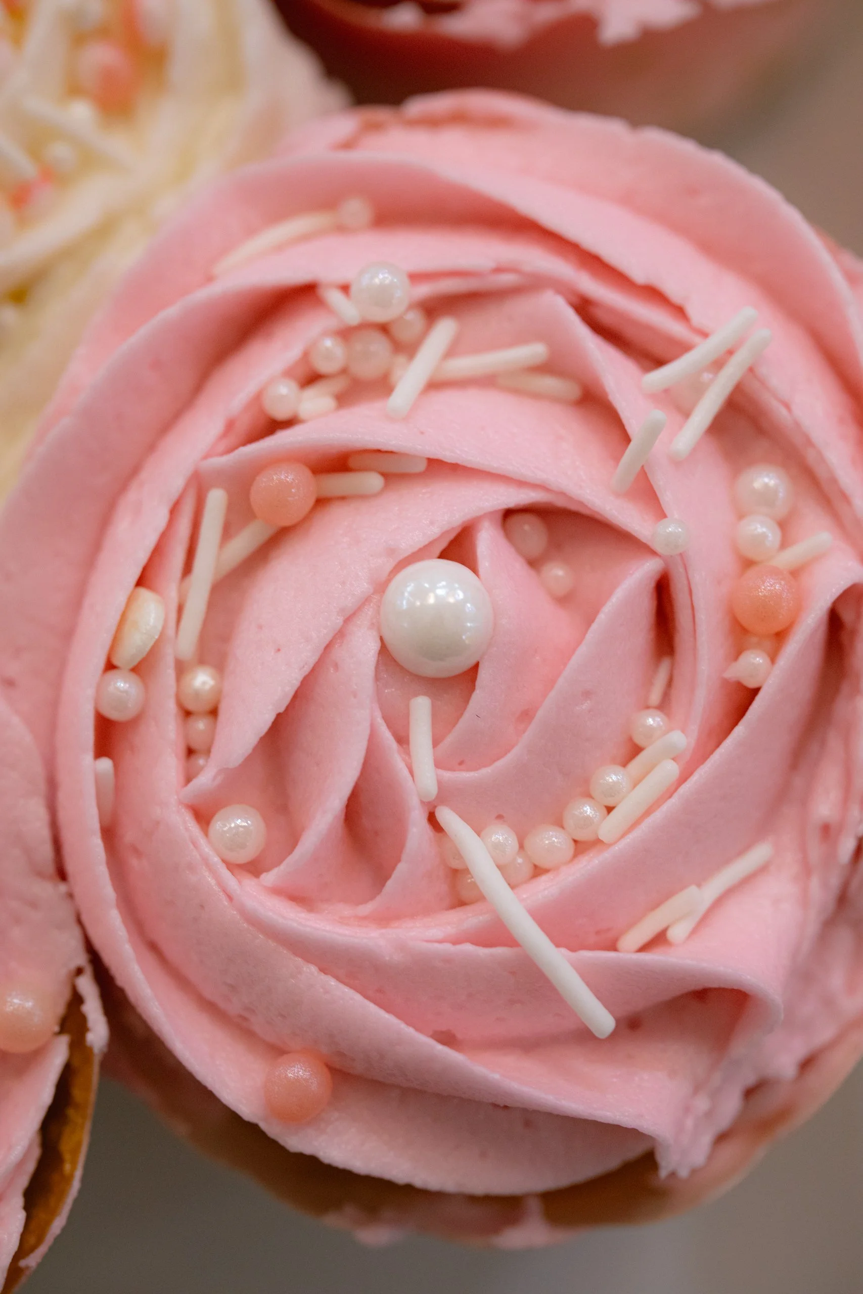  High-Quality Event Photograph: Pink Sprinkled Cupcake Captured from Above 