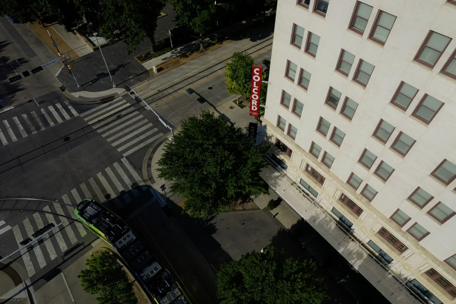 drone-commercial-branding-colcord-hotel-sign-downtown-okc-metro-street-car.webp