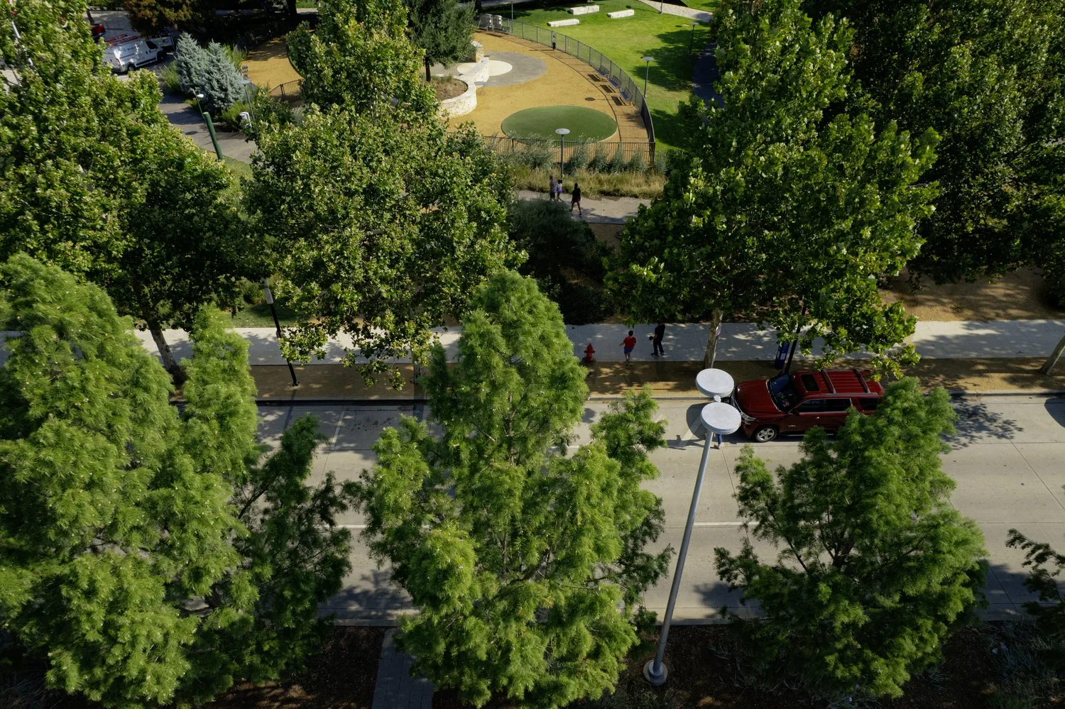 drone-documentary-lifestyle-okc-downtown-myriad-gardens-trees-people-walking.webp