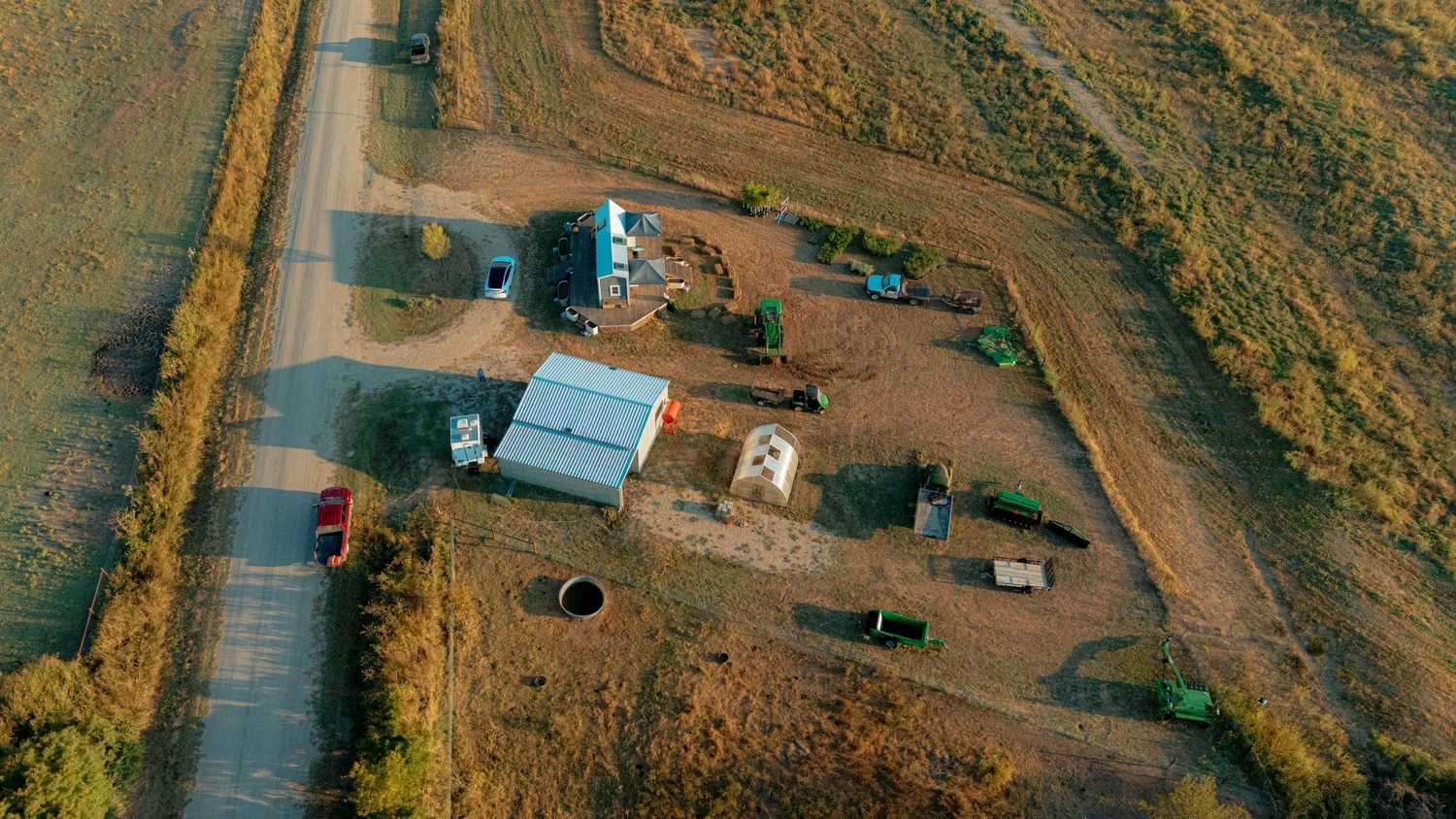 top-down-aerial drone-golden-hour-rural regenerative farm.webp