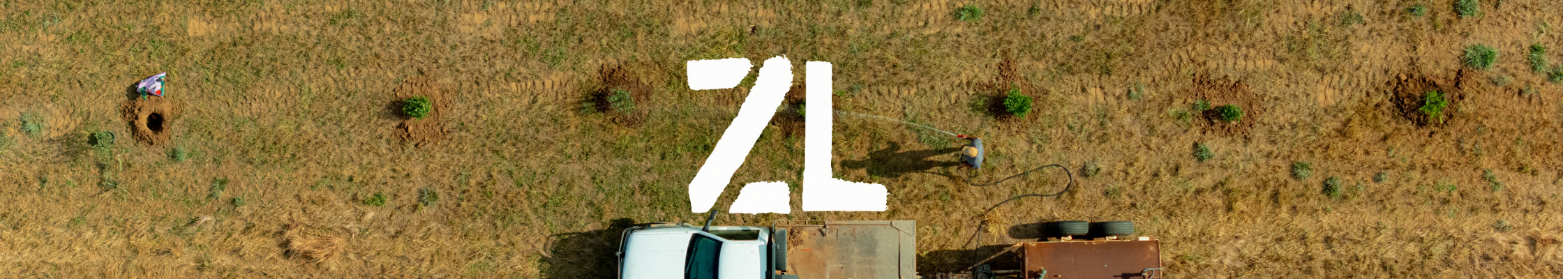Aerial drone photography looking straight down over a rural work site and farmland