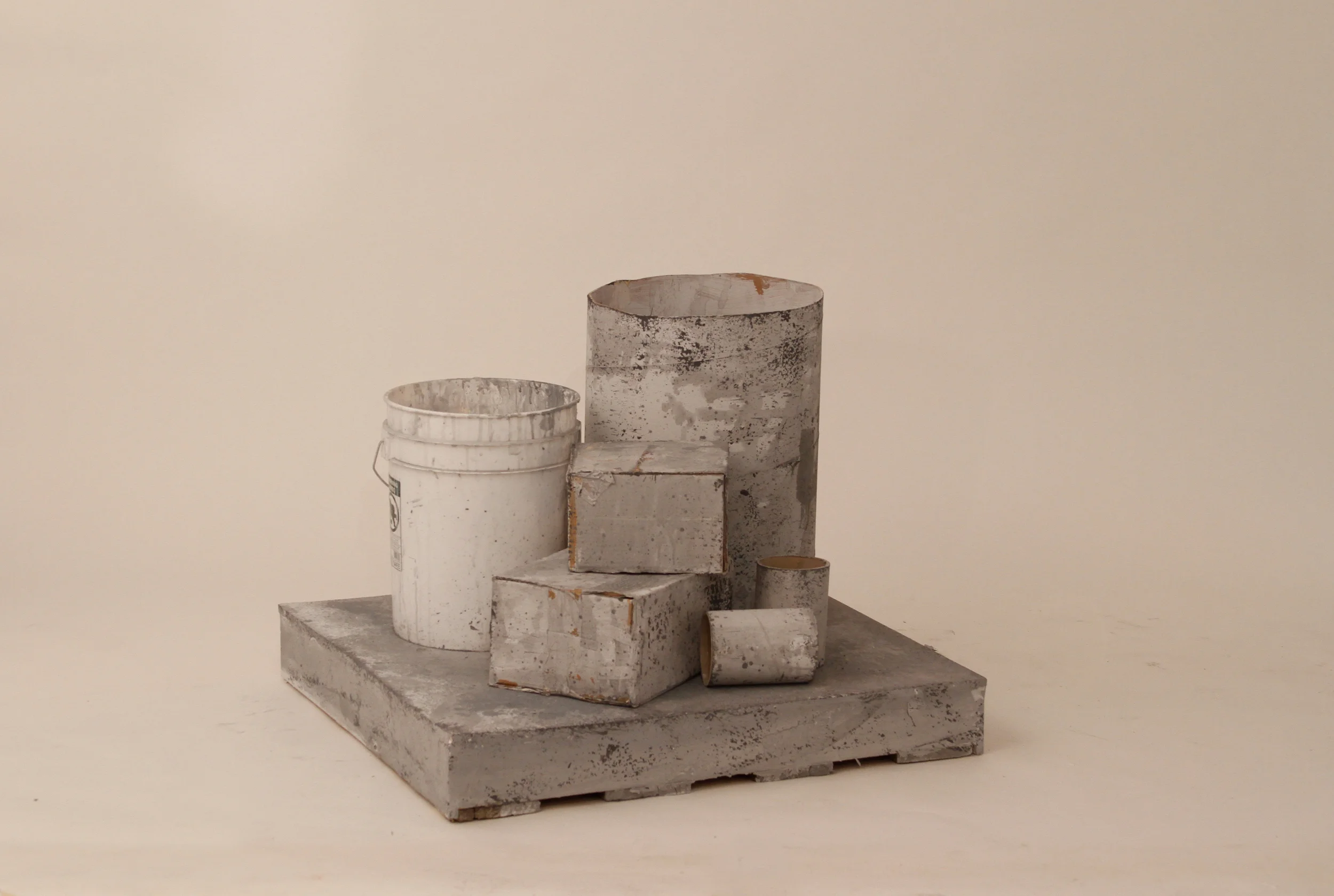  HOEKSTRA + OLMSTED  Title:&nbsp; When I go to sleep, I instruct my body to continue it’s healing at an even higher intensity than in my waking state.   Date: 2012  Materials: Flat latex paint, universal tints, plastic bucket, cardboard on wood  Dime