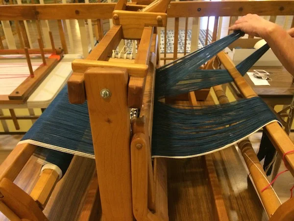 Almost done warping the loom with our indigo yarns!