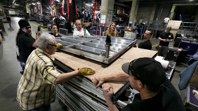 Members of the prop department prepare to move a stage floor that will be used during a performance at the Grammy Awards. (Mel Melcon / Los Angeles Times)