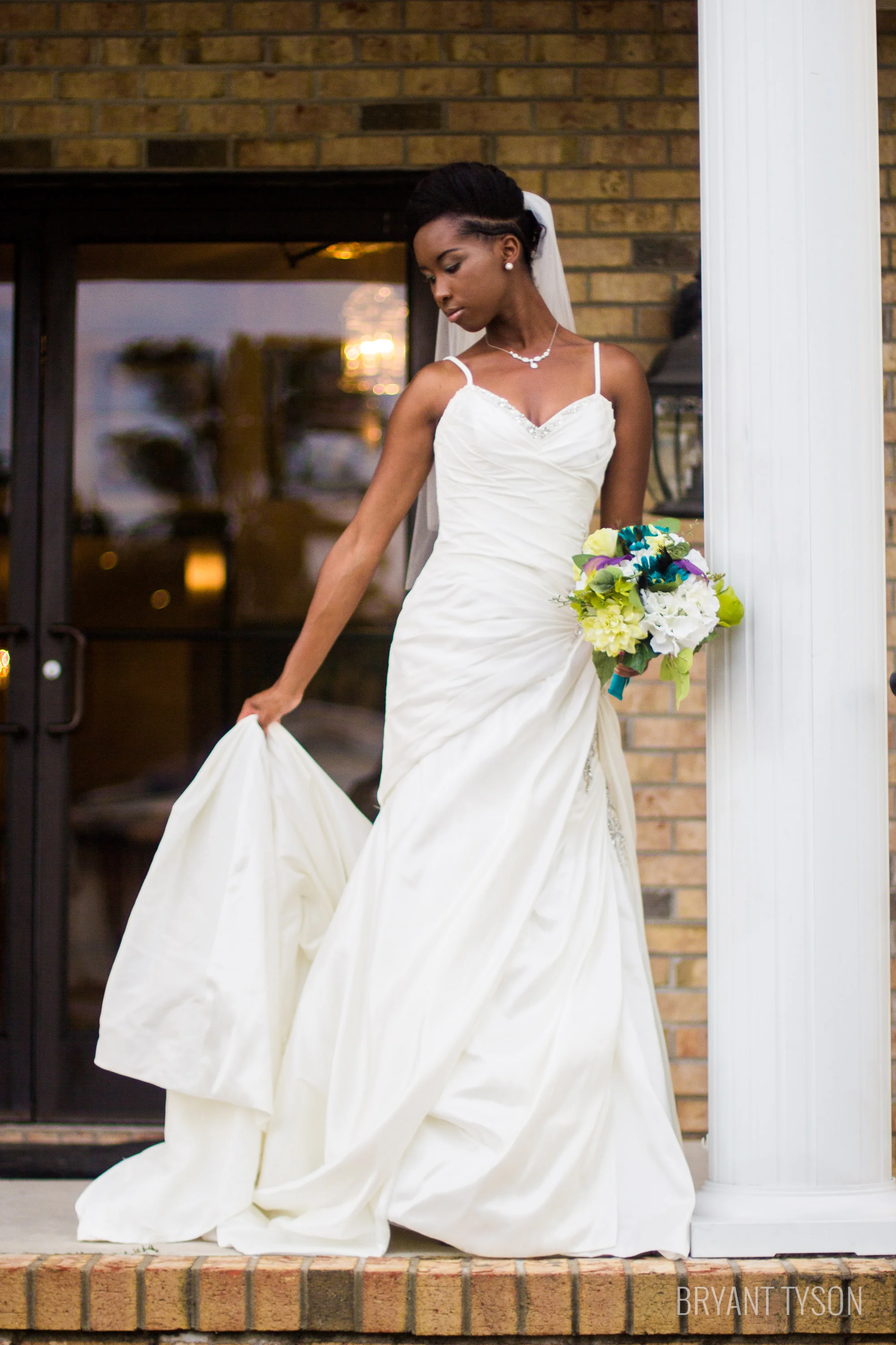 bridal portrait pose ideas bride holding train of dress