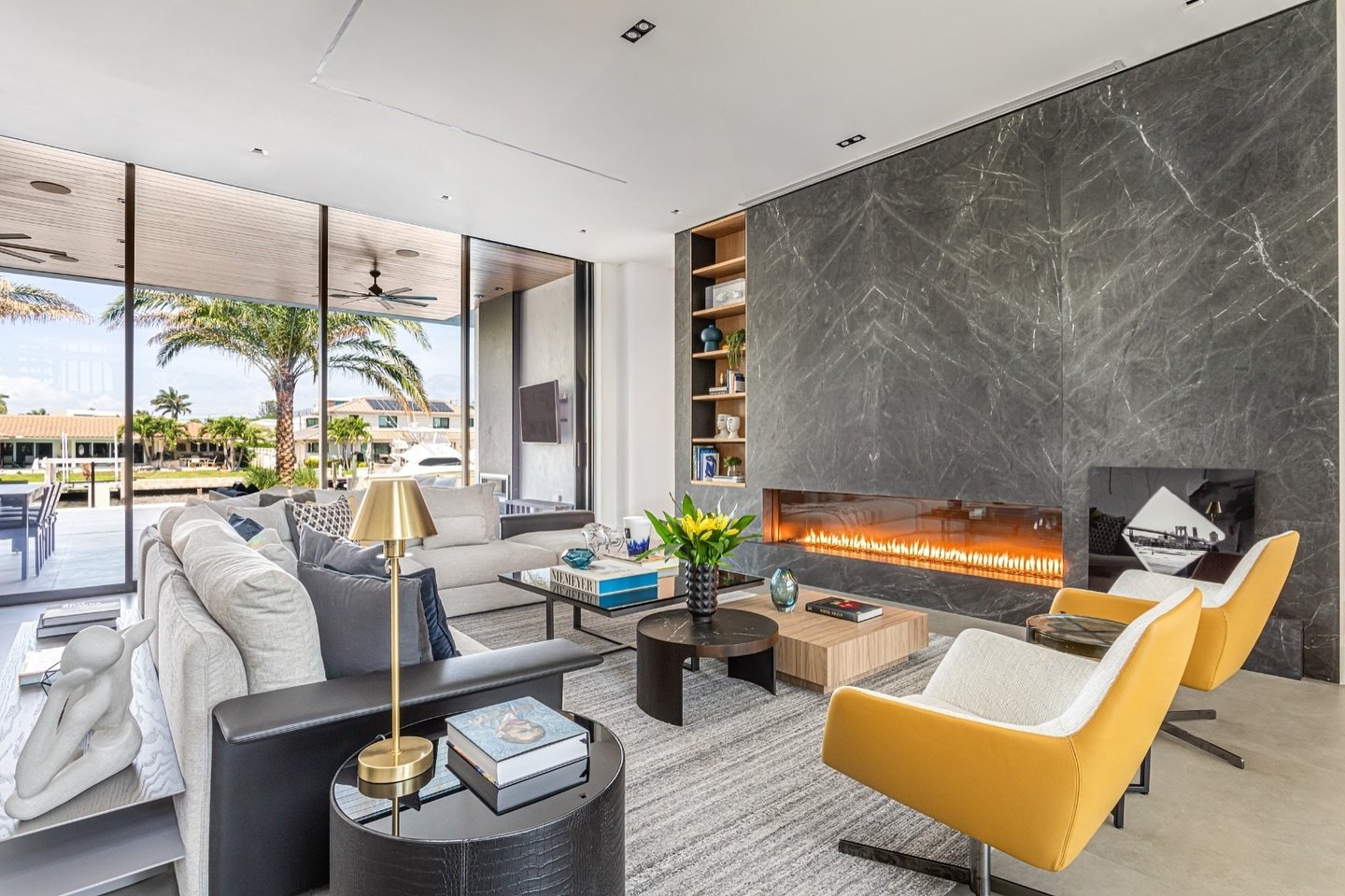 Who says you can&rsquo;t have a fireplace in Florida ? We love our design for this gorgeous waterfront living room.
.
.
.
#FloridaLiving #FireplaceGoals 🔥🌴