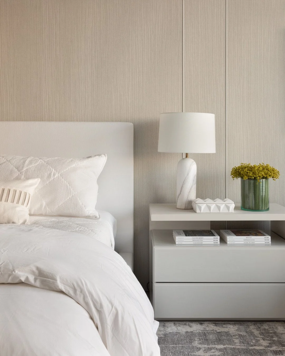 Some rooms are designed to help you breathe.
This primary suite blends soft textures, quiet color, and a few carefully chosen pieces that give it personality without ever feeling busy.
Every detail on the nightstand, every frame on the wall, was plac