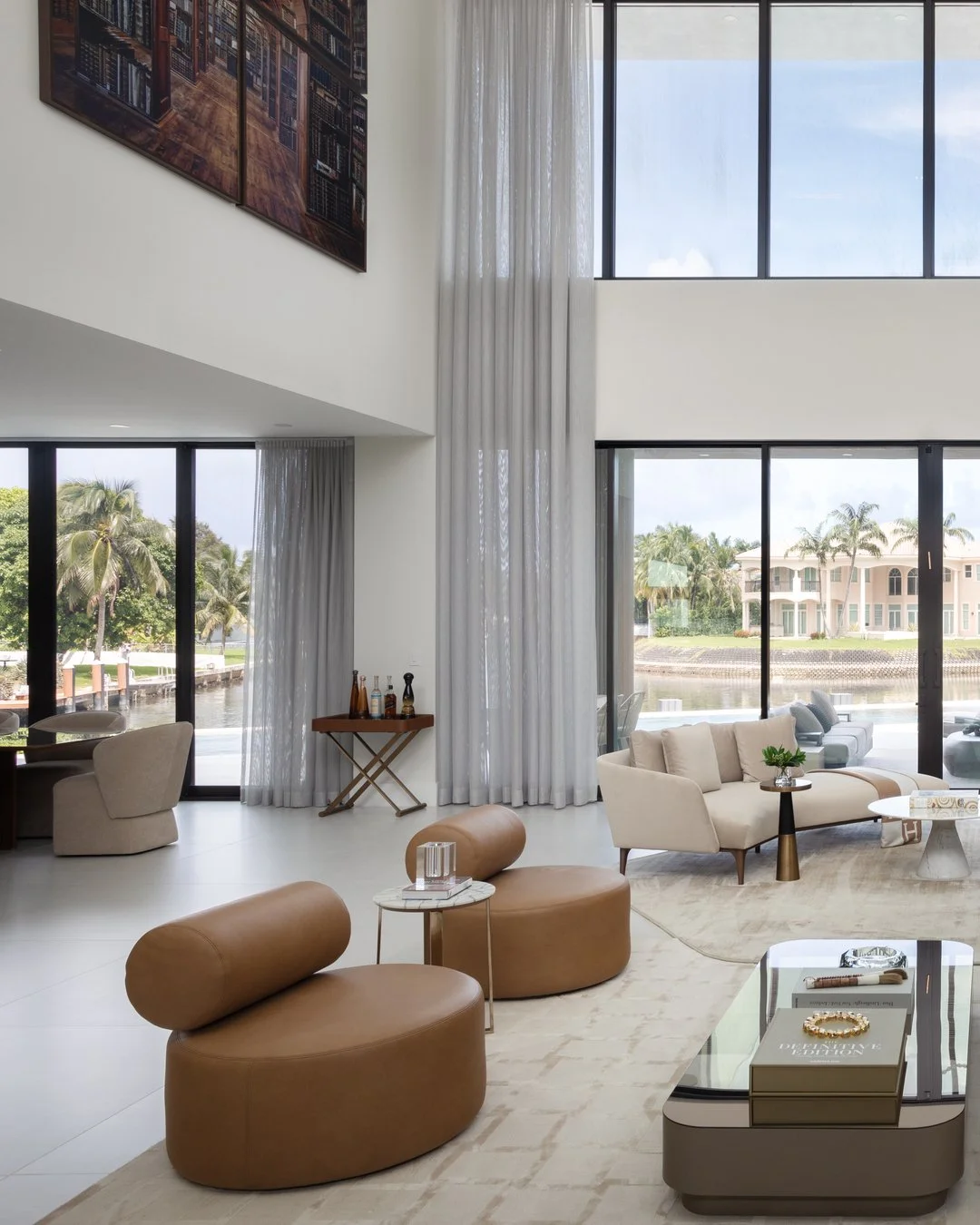 The ceiling height catches your eye right away. But it&rsquo;s the seating, gathered close together, that gives the living room a more welcoming scale.

There&rsquo;s room to take in the architecture, and just as much reason to sit down and talk. We 