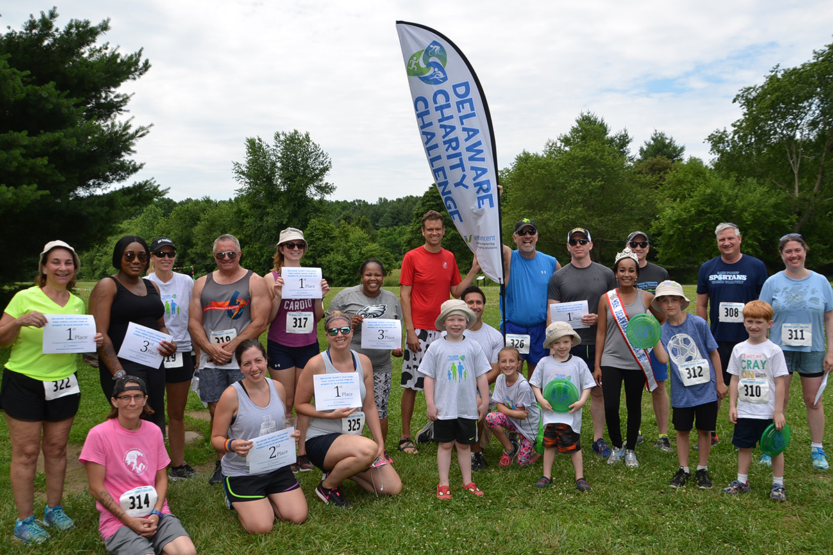 A few of the runners from the 1st Annual Race Across Killens Pond 5K pose for the camera after the race.