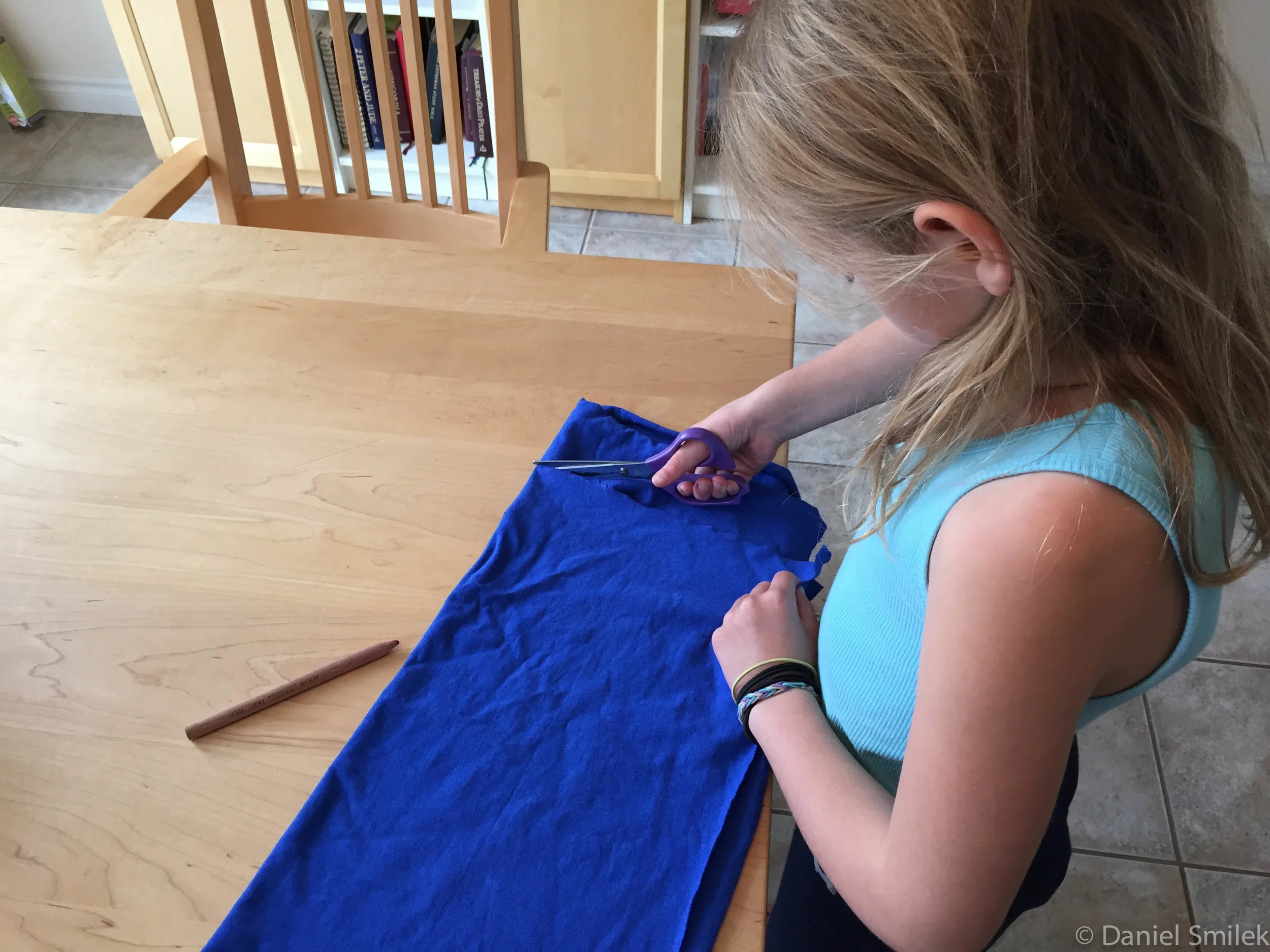 Cousin Eva cutting out her tubular bandana.