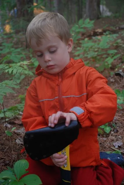 4 year old Josh putting away his axe as soon as he's finished using it.